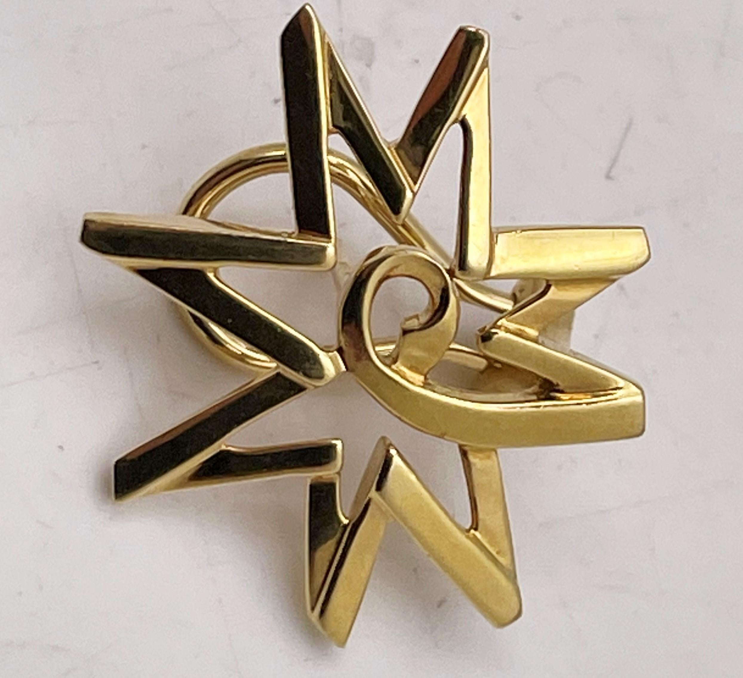 Tiffany & Co. 18k yellow gold rare starburst earrings, designed by Paloma Picasso, with a beautiful, geometric design. They measure 1'' in diameter by 1/4'' in depth, weigh 10.5 grams (0.338 ozt), and bear hallmarks as shown. Sold in original