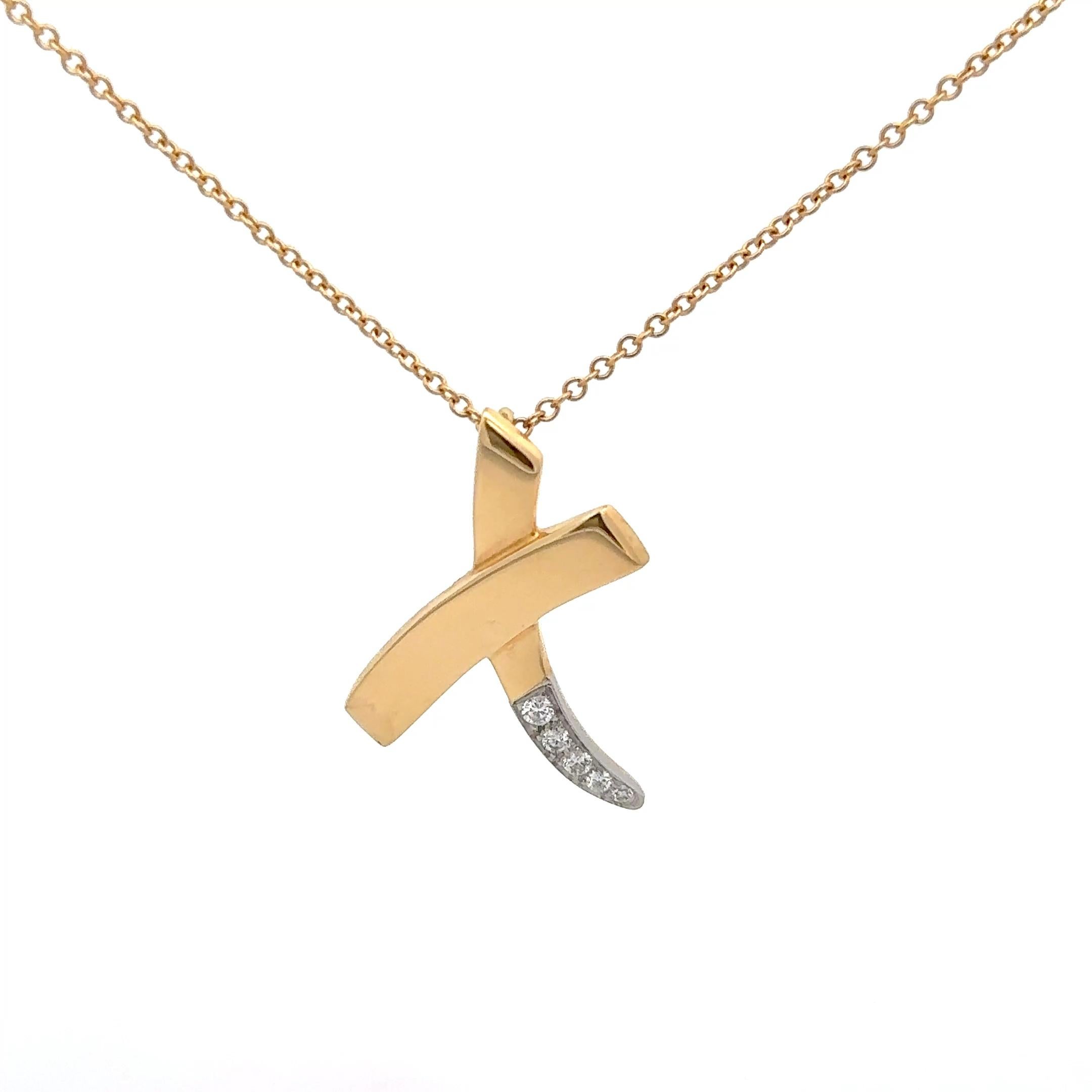 Tiffany & Co. by Paloma Picasso Graffiti X Pendant Necklace in 18K Yellow Gold. The pendant is accented by five brilliant round diamonds set in platinum, on a 16 inch chain. Marked 1983 Tiffany&Co 18k Plat Paloma Picasso. The pendant approximately