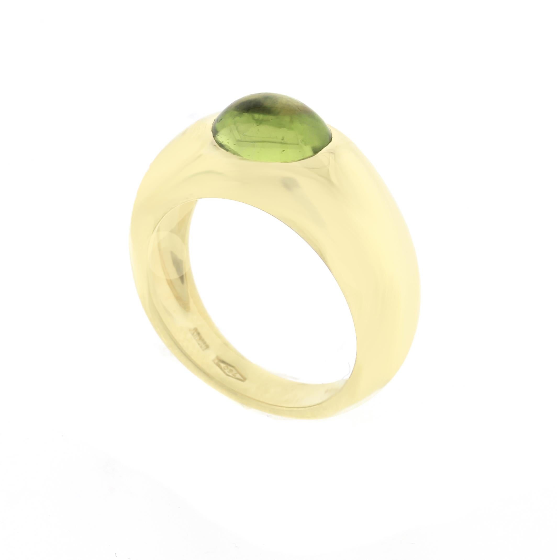From Tiffany & Co. an oval cabochon peridot set in 18 karat gold
♦ Designer: Tiffany Co
♦ Metal: 18 karat 8.2 grams
♦ Ring 8.3mm wide tapering to 3.7mm
♦ Citrine 9 X 7mm
♦ Circa 2000
♦ Size 6¼, Resizable
♦ Tiffany pouch
♦ Condition: Excellent ,