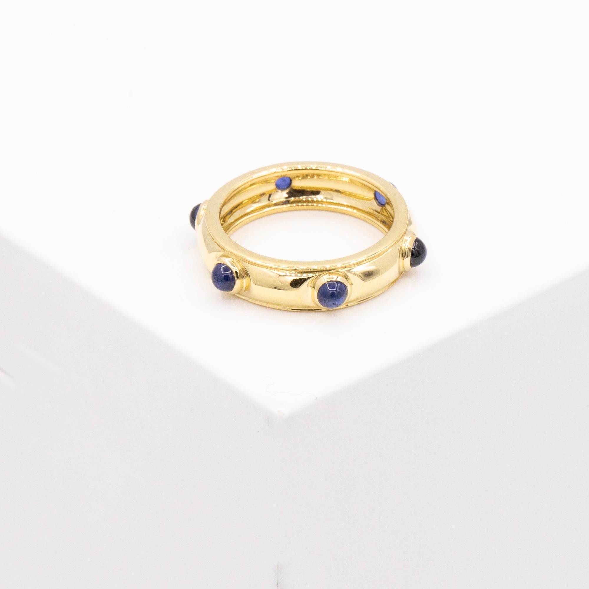 18kt Yellow Gold band stamped Tiffany & Co. Size 6. CIRCA 1980s. There are 6 Cabochon sapphires weighing 3.35 dwt in total.