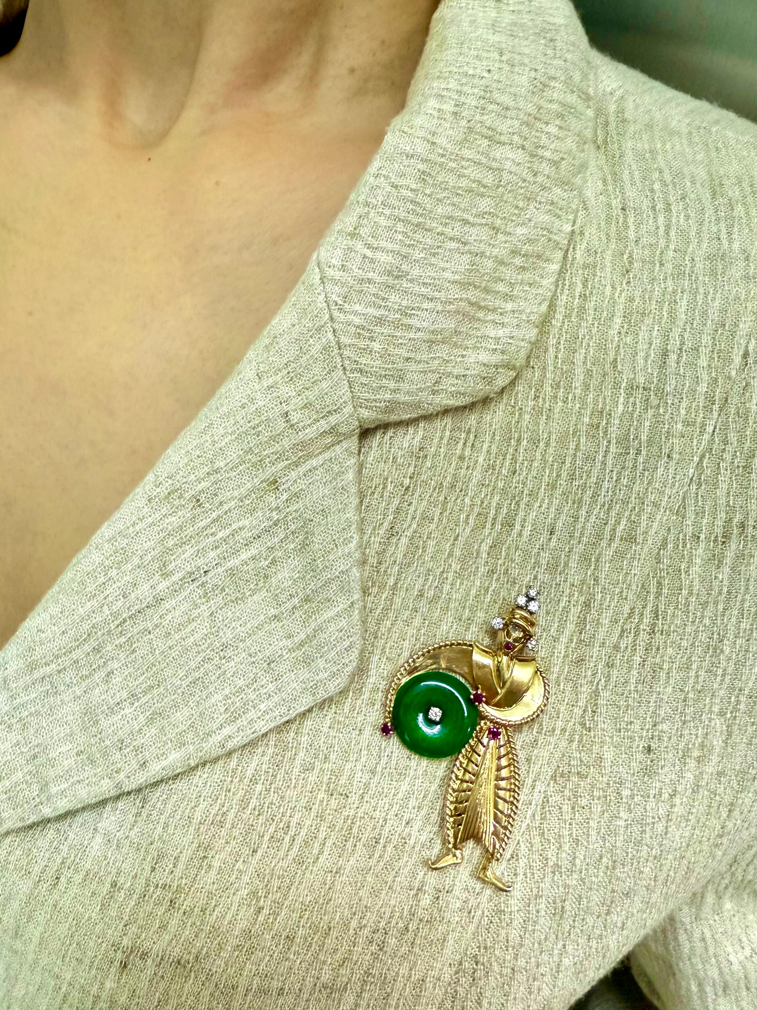Please check out the HD video. This brooch / pendant is hallmarked, stamped and numbered (10135) by Tiffany & Co. This was made in 14k yellow gold circa 1950. The main attraction is the intense green natural jade. The jade disc (~15.46mm) is