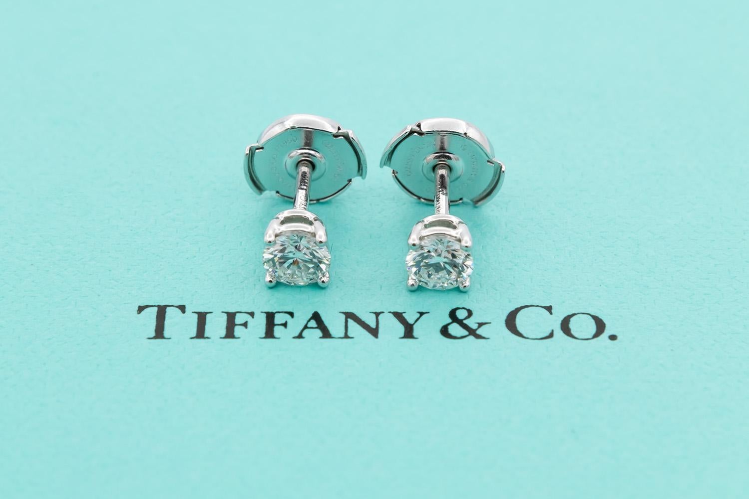 We are pleased to present these Tiffany & Co. Certified and Crown Inscribed Platinum & Round Brilliant Cut Diamond Stud Earrings. These beautiful earrings feature two Tiffany & Co. certified and crown inscribed 0.33ct F/VVS2 Round Brilliant Cut