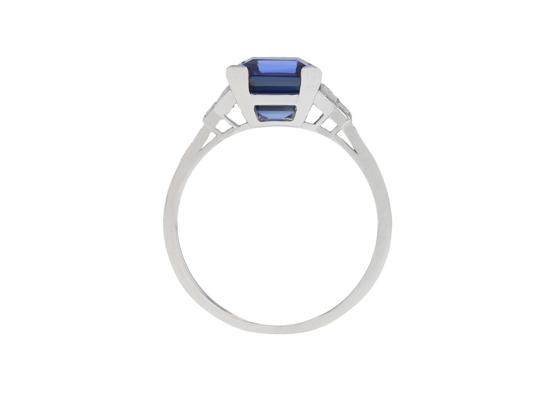Tiffany & Co Ceylon sapphire and diamond flanked solitaire ring. Set to centre with a rectangular step cut natural unenhanced Ceylon sapphire in an open back claw setting with an approximate weight of 4.25 carats, flanked by four rectangular