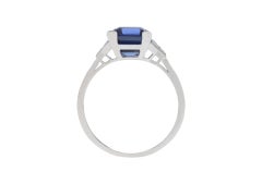 Tiffany & Co. Ceylon sapphire and diamond flanked solitaire ring, American, circ