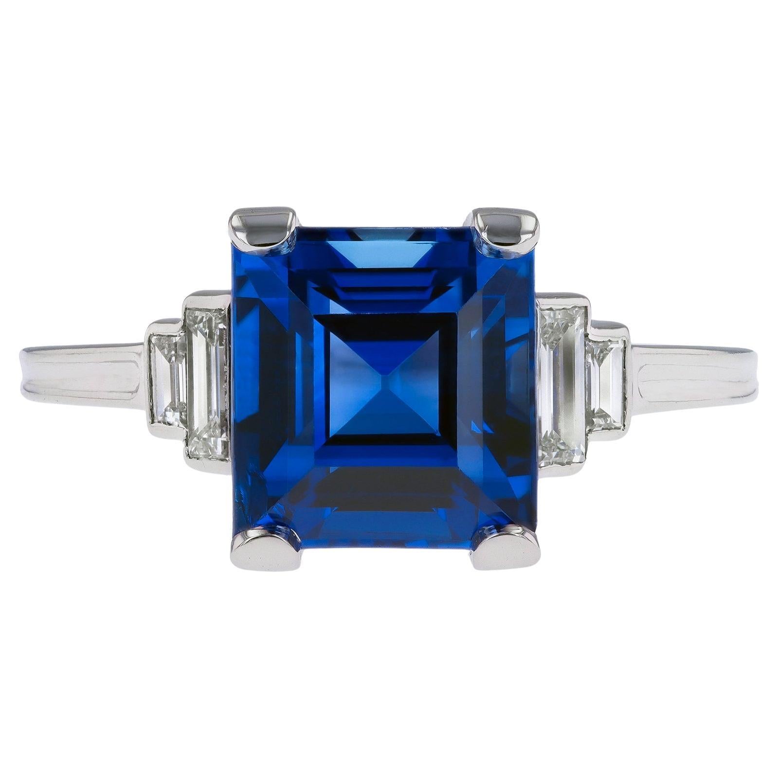 Tiffany & Co. Ceylon sapphire and diamond flanked solitaire ring, American, circ For Sale