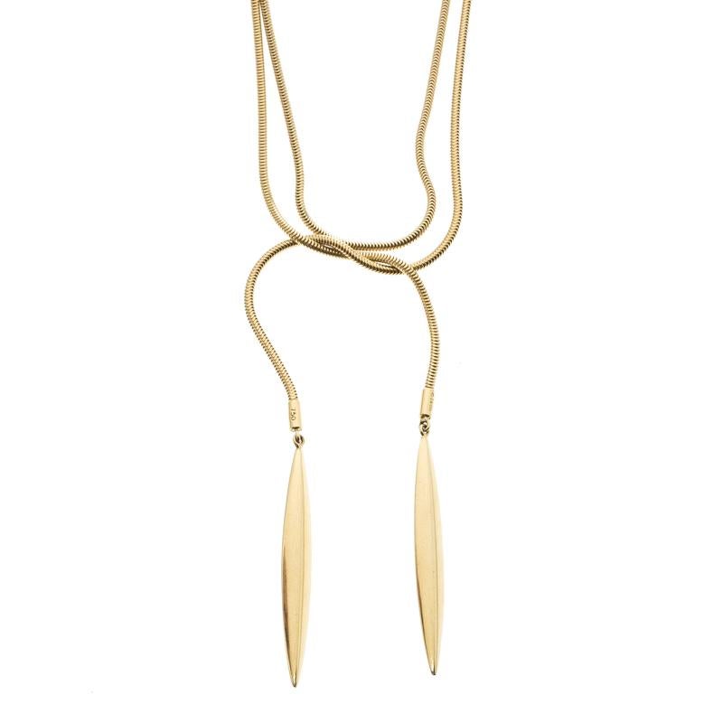 Gift yourself some love with this necklace from Tiffany & Co.! The piece is impeccably made from 18k yellow gold in a wrap style with feather tips. The necklace has undergone intricate detailing to achieve this state of beauty. Wear it on your