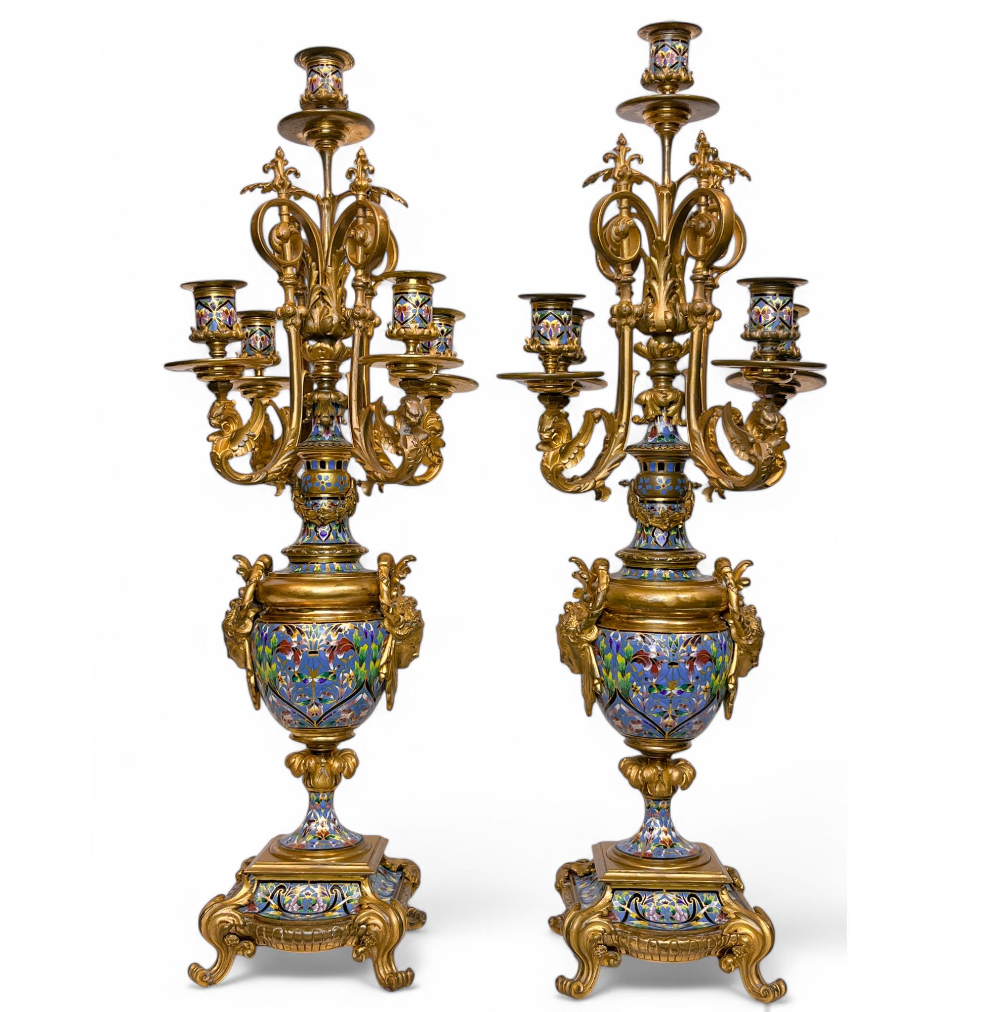 Tiffany & Co Blue Champlevé and Bronze Clock Set with matching Champlevé Candelabras

Retailed by Tiffany & Co , New York. 

Stamped Tiffany & co on the internal clock mechanism 
Date: Circa 1880's
Dimension:

Clock: 24
