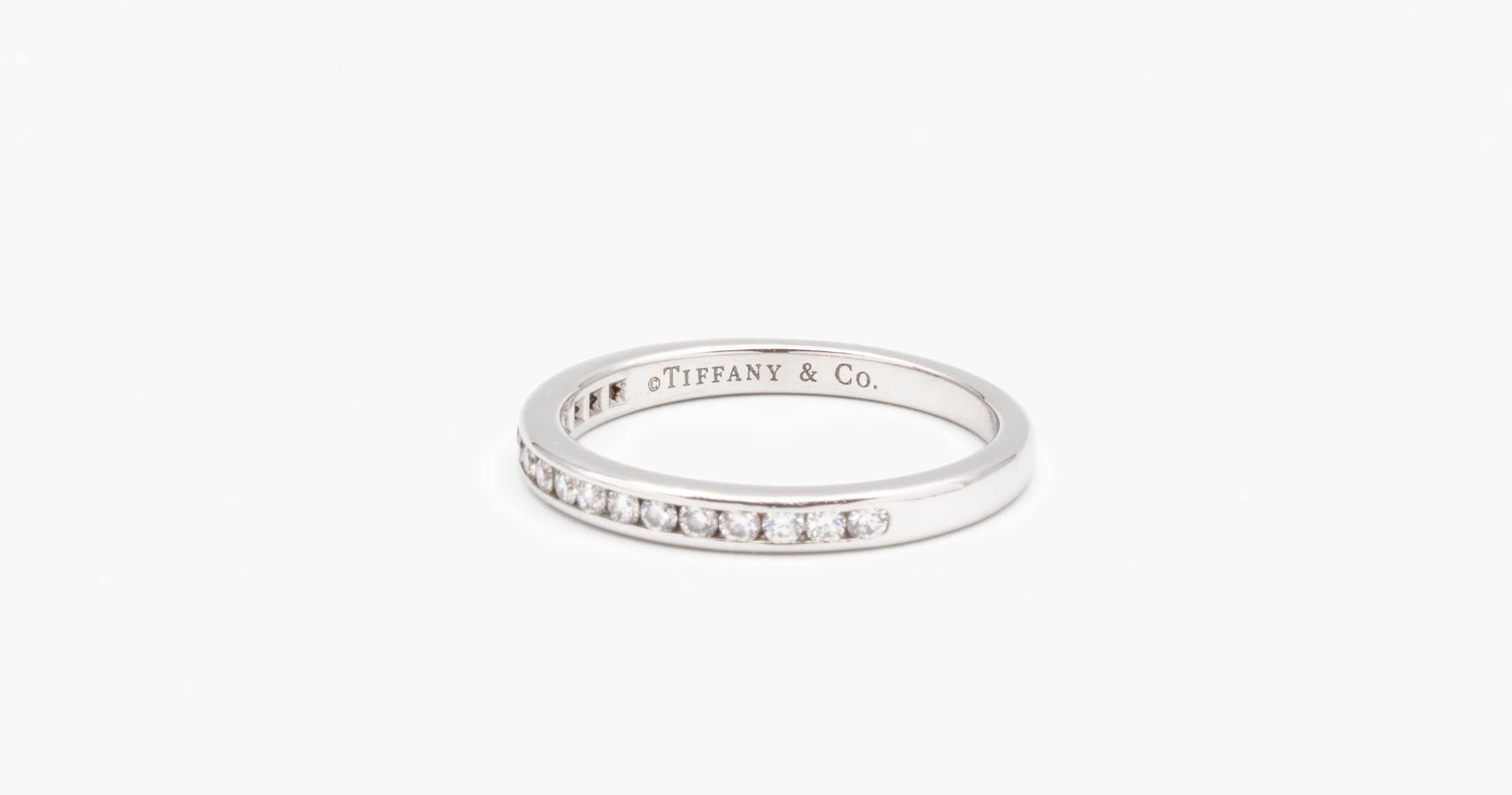Tiffany & Co Channel set Wedding/Anniversary band finely crafted in Platinum with channel set round brilliant cut diamonds weighing 0.17 cts. in ranging in near colorless F-G  and VVS clarity with no visible inclusions, Very fine quality just as you