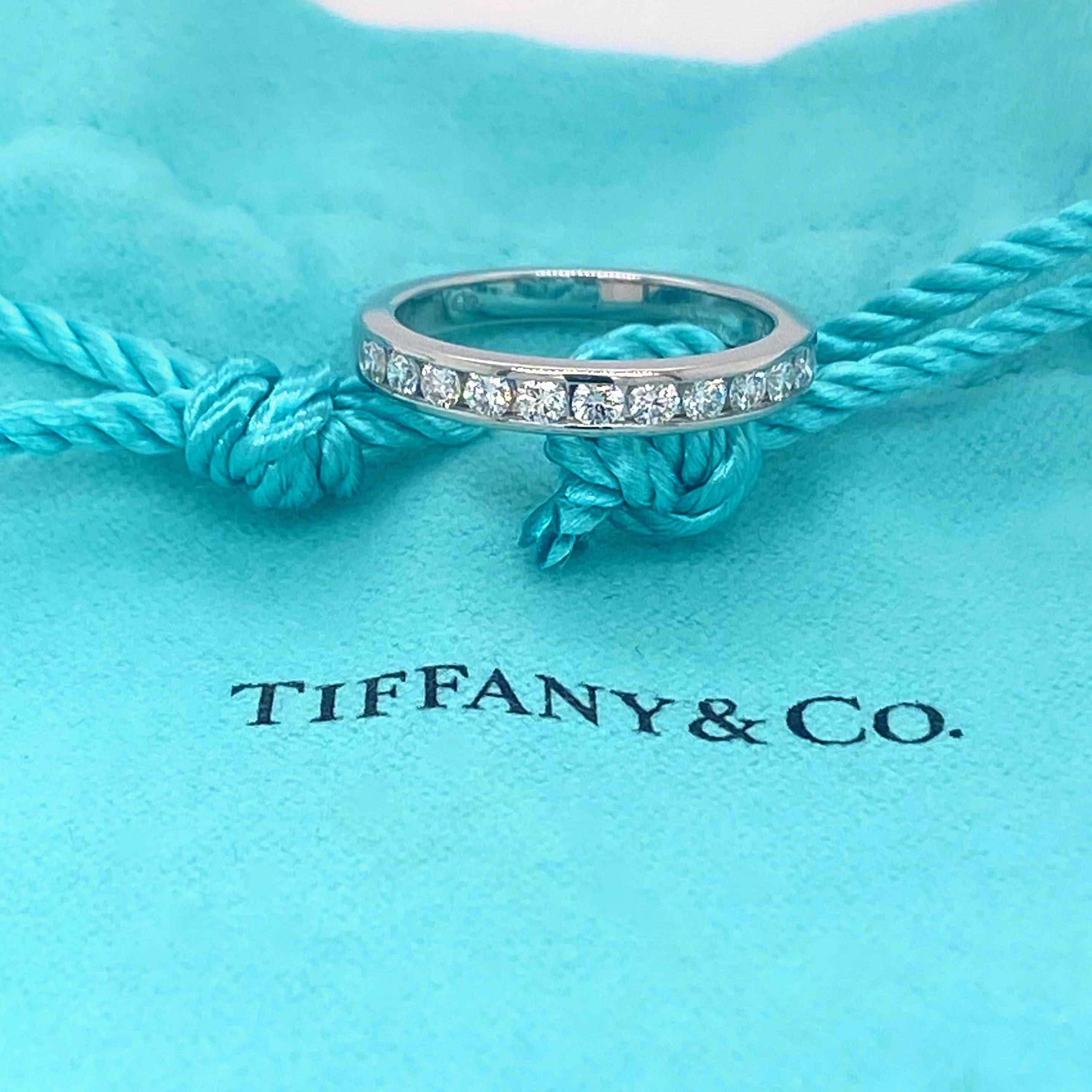 Tiffany & Co Tiffany Diamond Wedding Band Ring
Style:  Channel-Set Half Circle
Metal:  Platinum PT950
Size:   5.75
Measurements:  3 MM Width
TCW:  0.33 tcw
Main Diamond:  Round Brilliant Diamonds 
Color & Clarity:  G, VVS
Hallmark:  ©TIFFANY&CO.