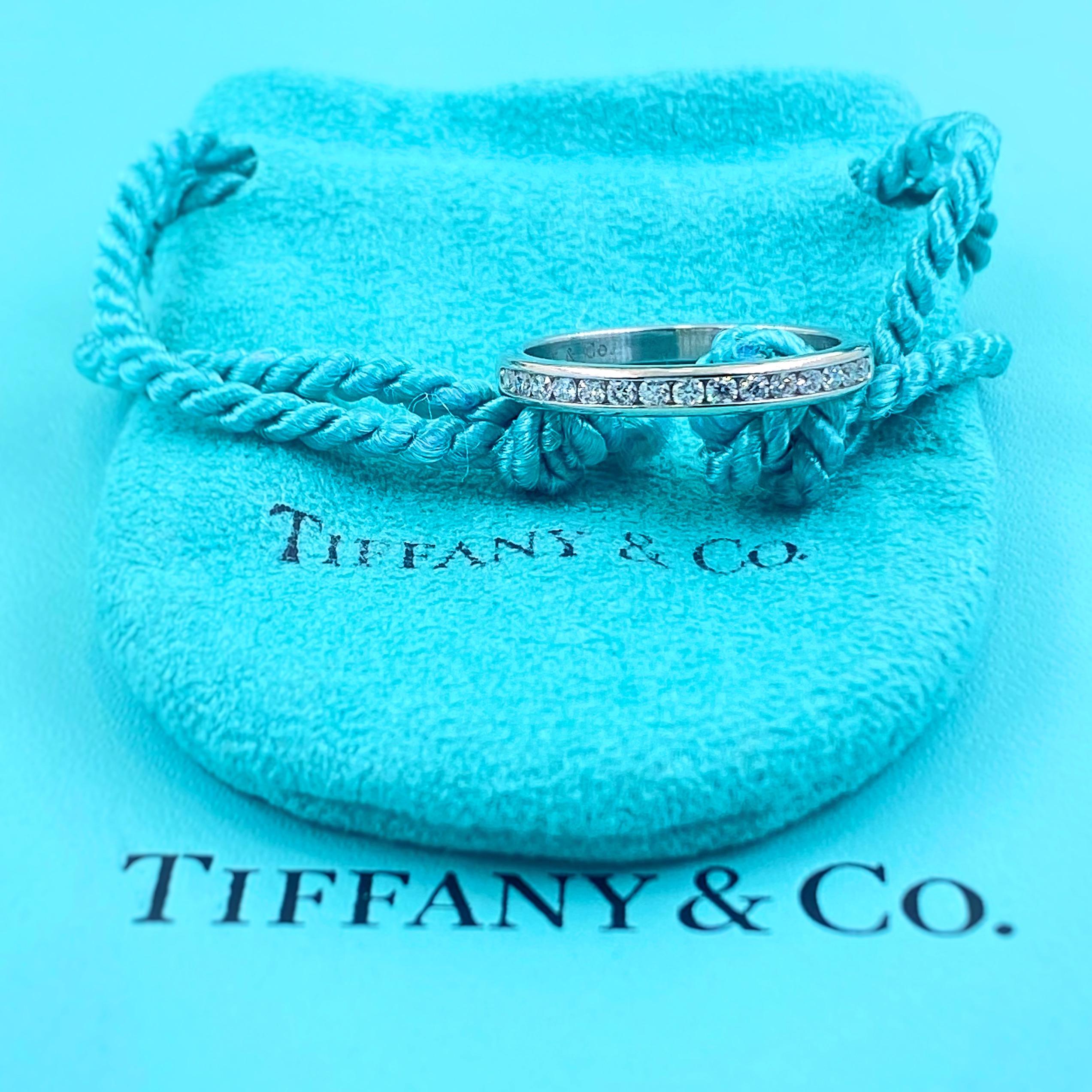 Tiffany & Co. Diamond Wedding Band
Style:  Half-Circle Channel-Set 
Metal:  Platinum PT950
Size / Measurements:  2.5 MM Width / 6.75 - sizable
TCW:  0.24 tcw
Main Diamond:  15 Round Brilliant Diamond
Color & Clarity:  G - VVS
Hallmark:  ©TIFFANY&CO.