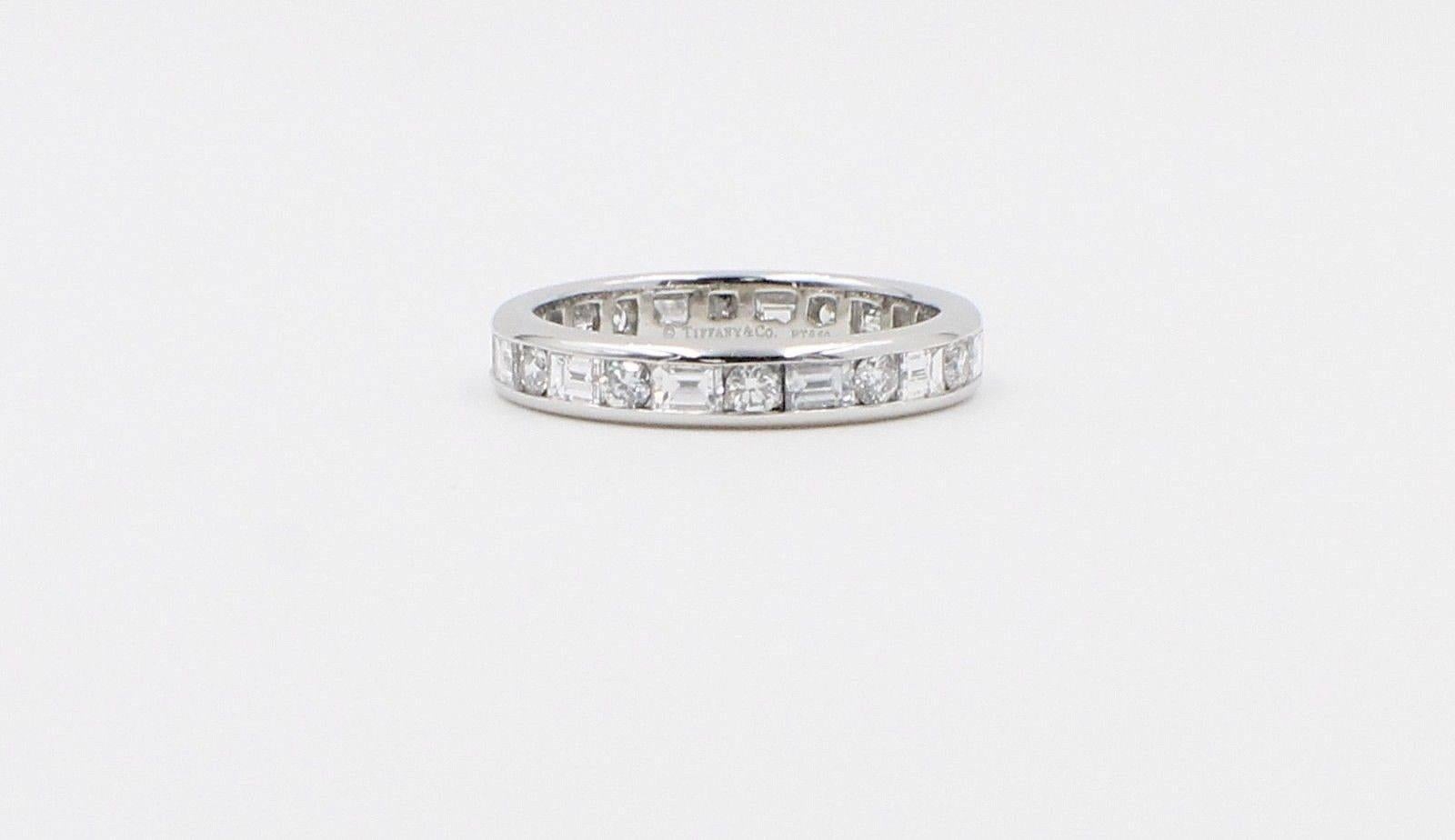 Tiffany & Co.
Style:  Channel Set Round Diamonds & Baguette Diamonds Band Ring
Serial Number:  17669664
Metal:  Platinum PT950
Width:  3 MM
Size:  6
Total Carat Weight:  1.51 TCW
Diamond Shape:  Round Brilliant Diamonds 0.43 TCW & Baguette Diamonds