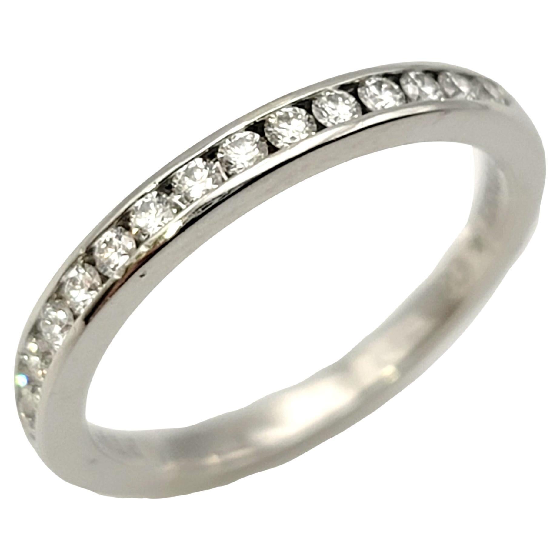 Ring size: 3.75

Stunning Tiffany & Co. diamond semi eternity band ring. This timeless beauty features 15 bright white diamonds set in a half circle in a highly polished platinum setting. The platinum really enhances the white brilliance of the