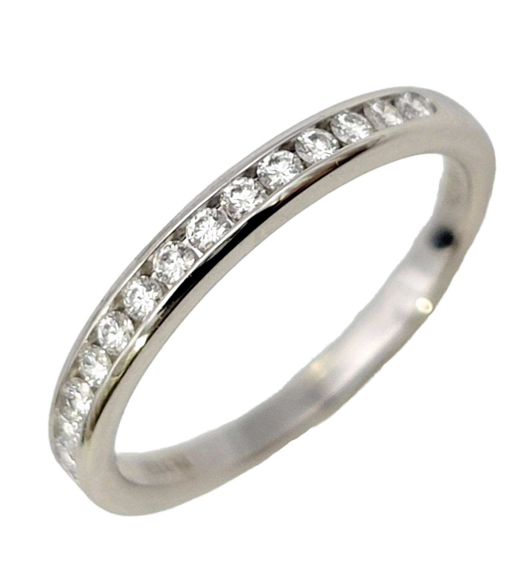 Ring size: 5

Stunning Tiffany & Co. diamond semi eternity band ring. This timeless beauty features 17 bright white diamonds set in a half circle in a highly polished platinum setting. The platinum really enhances the white brilliance of the