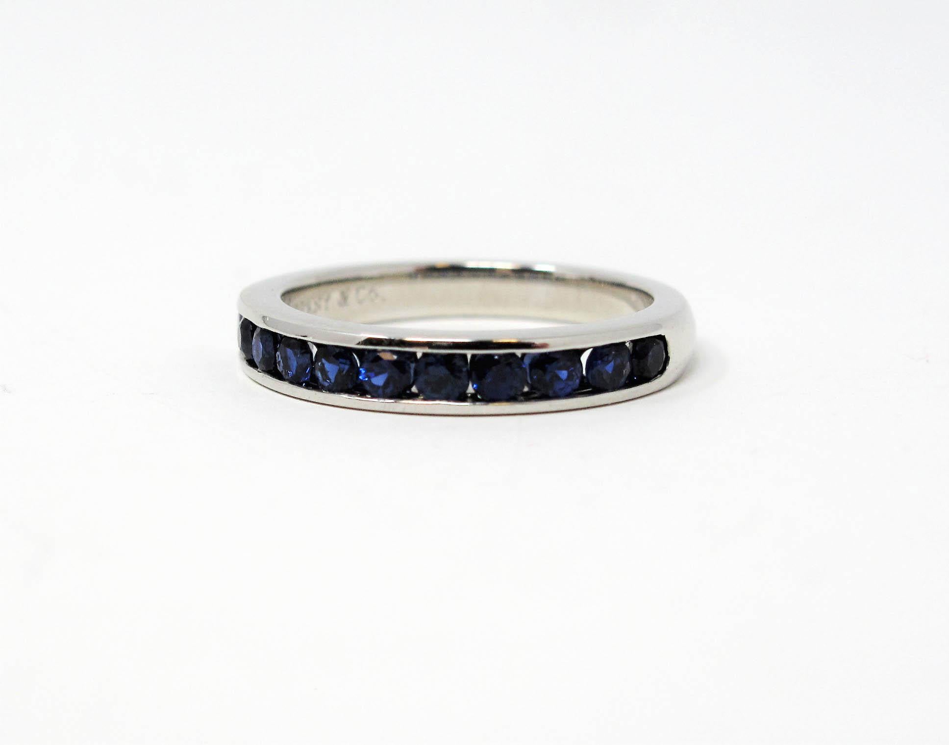 Ring size: 5

Stunning Tiffany & Co. sapphire semi eternity band ring. This timeless beauty features brilliant blue sapphires channel set in a single elegant row. The sleek polished band has a modern, yet feminine feel. It would be stunning paired