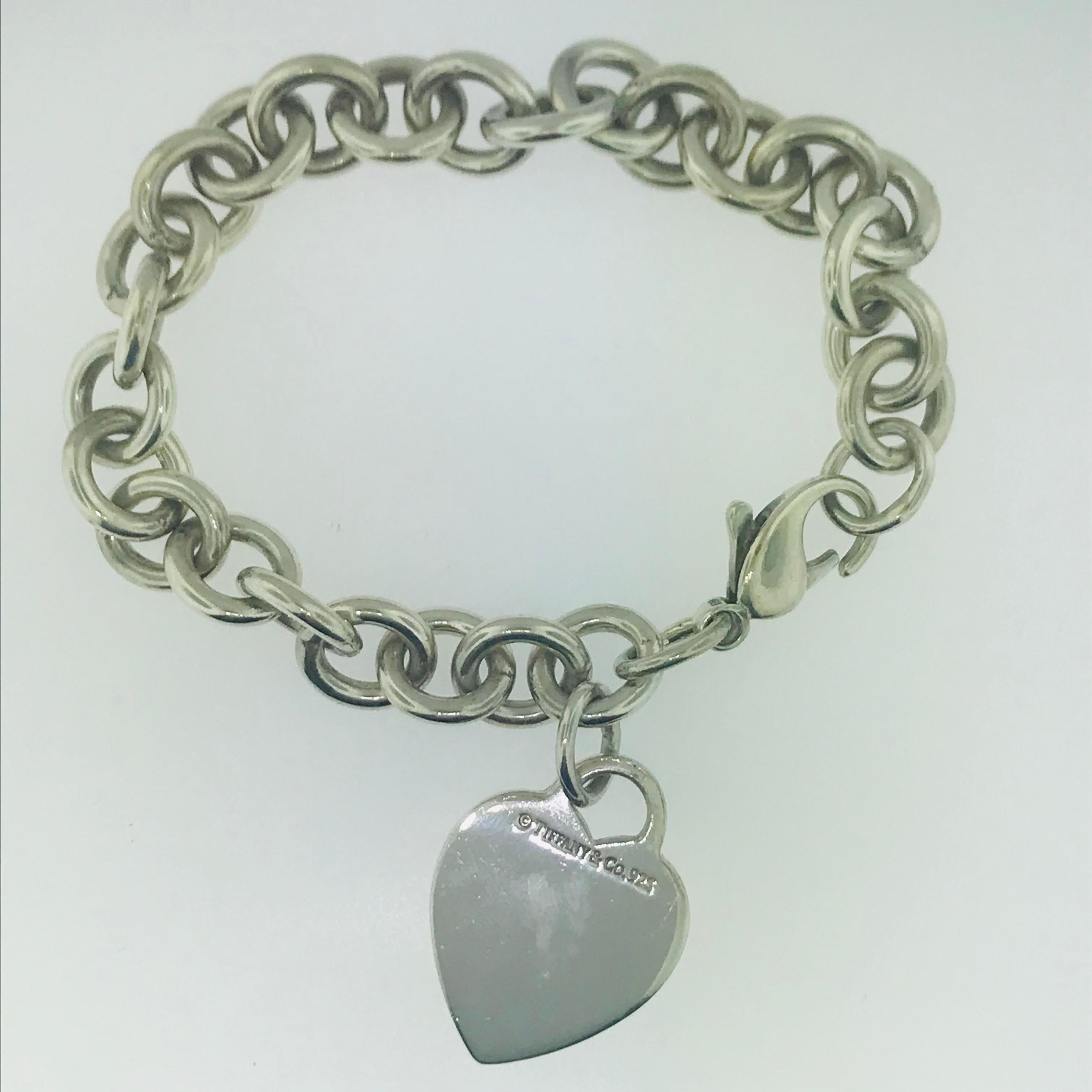 A true classic. This Tiffany & Co.sterling silver chain bracelet is a truly classy and timeless piece to add to any fine jewelry collection. This Tiffany & Co. charm bracelet has large links that are high quality and high polish. A great addition to