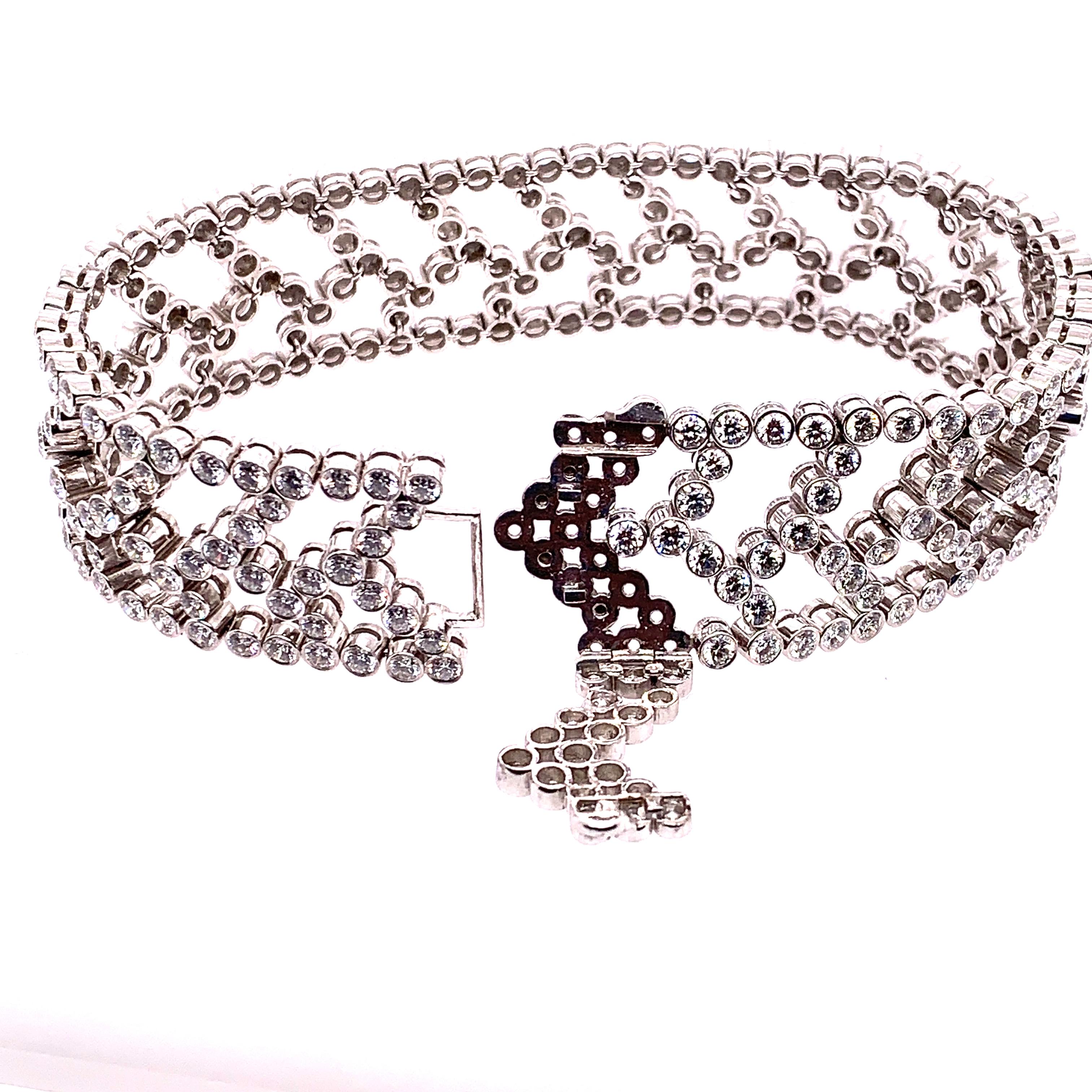 A flexible bracelet with a stylized chevron motif collet. Set with approximately 276 Round Brilliant cut diamonds weighing approximately 15.00 carats.

Bracelet length is approximately 180 mm (7.08 inches).

Signed Tiffany and Co. 

Complete your