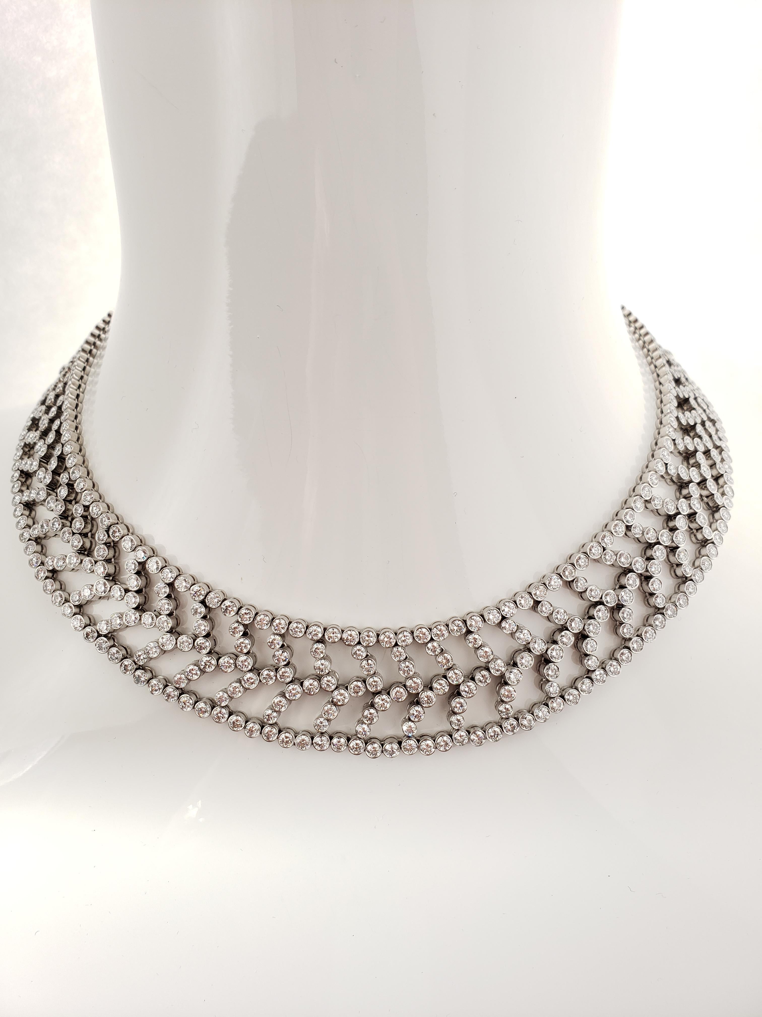 A Tiffany & Co. flexible necklace with a stylized chevron motif collet. 
Set with approximately 670 Round Brilliant cut diamonds weighing approximately 36.85 carats.
(Oroginal Tiffany & Co. marks as depicted)
A beautiful and timelss style for any