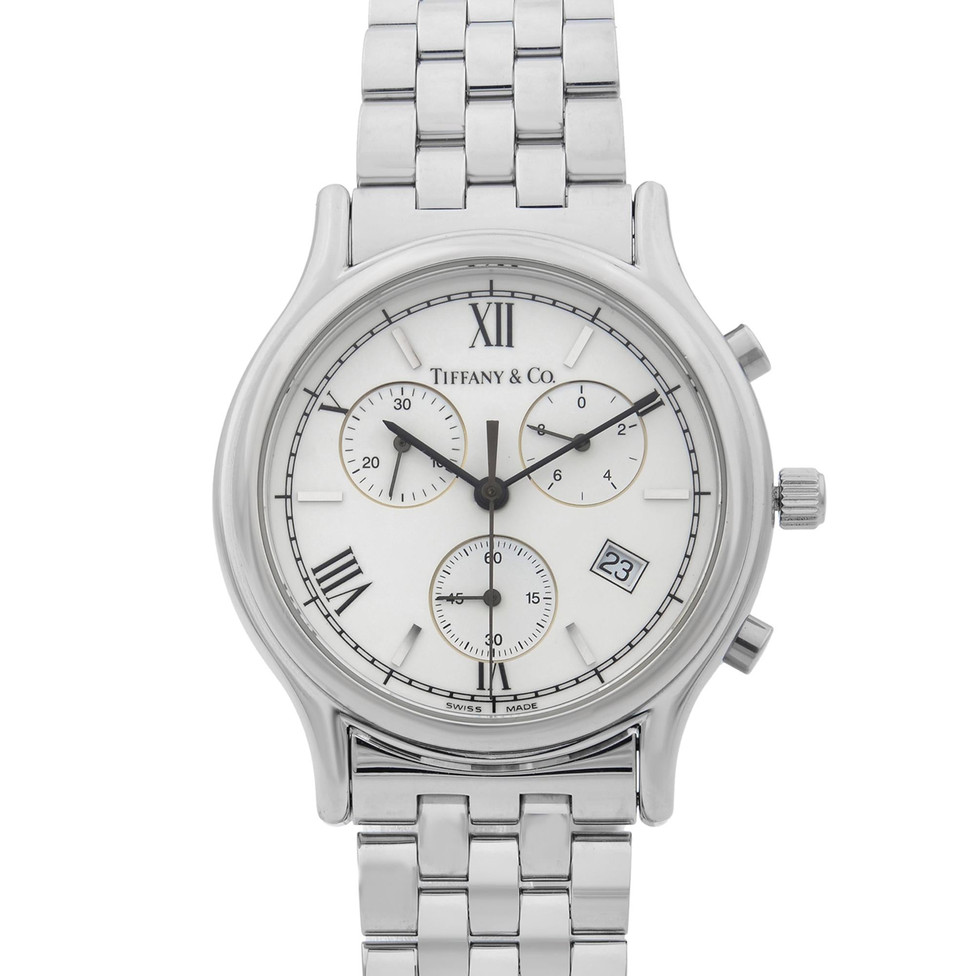 This pre-owned Tiffany & Co  NA is a beautiful men's timepiece that is powered by quartz (battery) movement which is cased in a stainless steel case. It has a round shape face, chronograph, date indicator, small seconds subdial dial and has hand