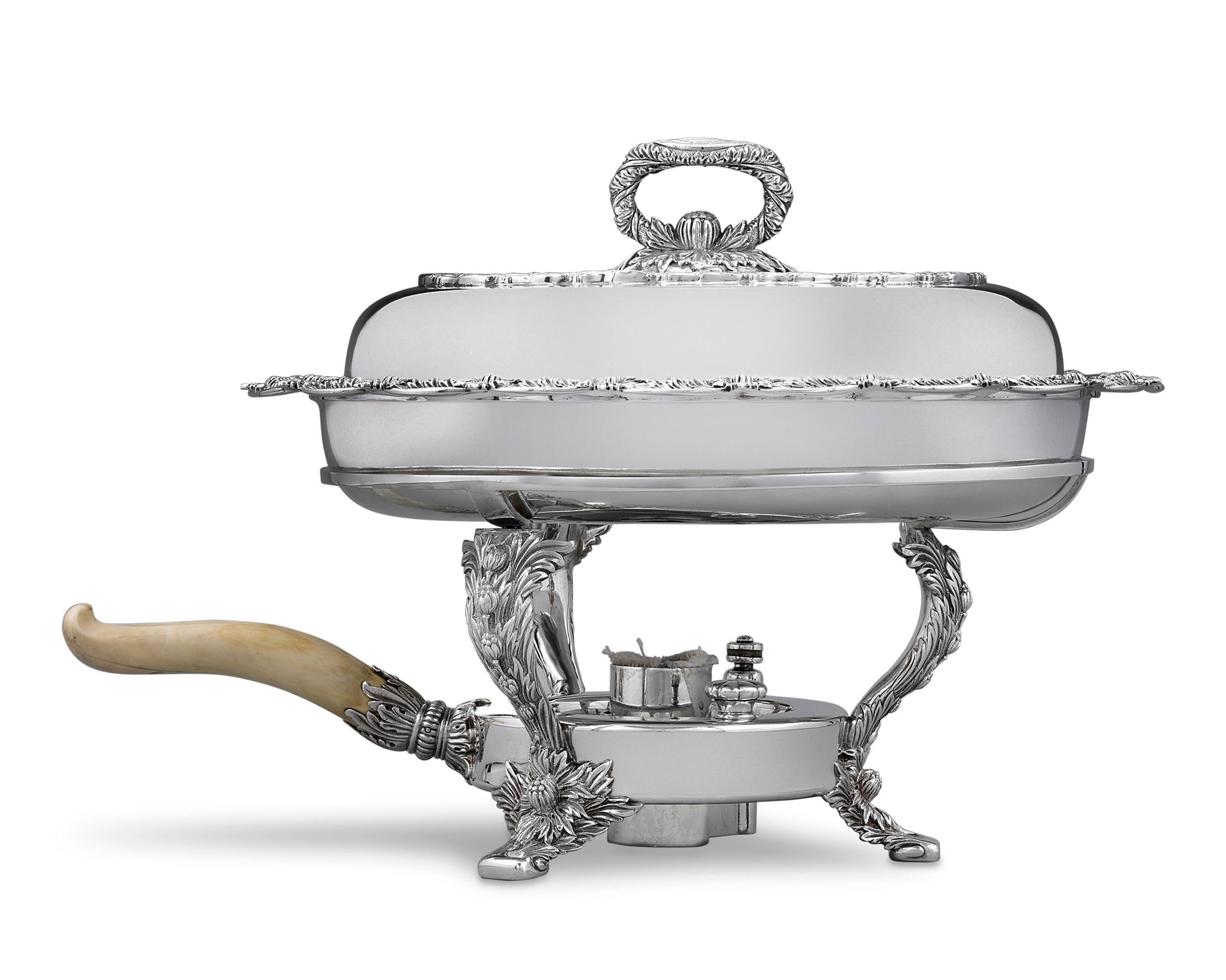 A truly exceptional specimen of holloware by the incomparable Tiffany & Co., this sterling silver chafing dish is fashioned in the time-honored Chrysanthemum pattern. The richly chased and applied blossoms of the ancient herbaceous plant envelopes