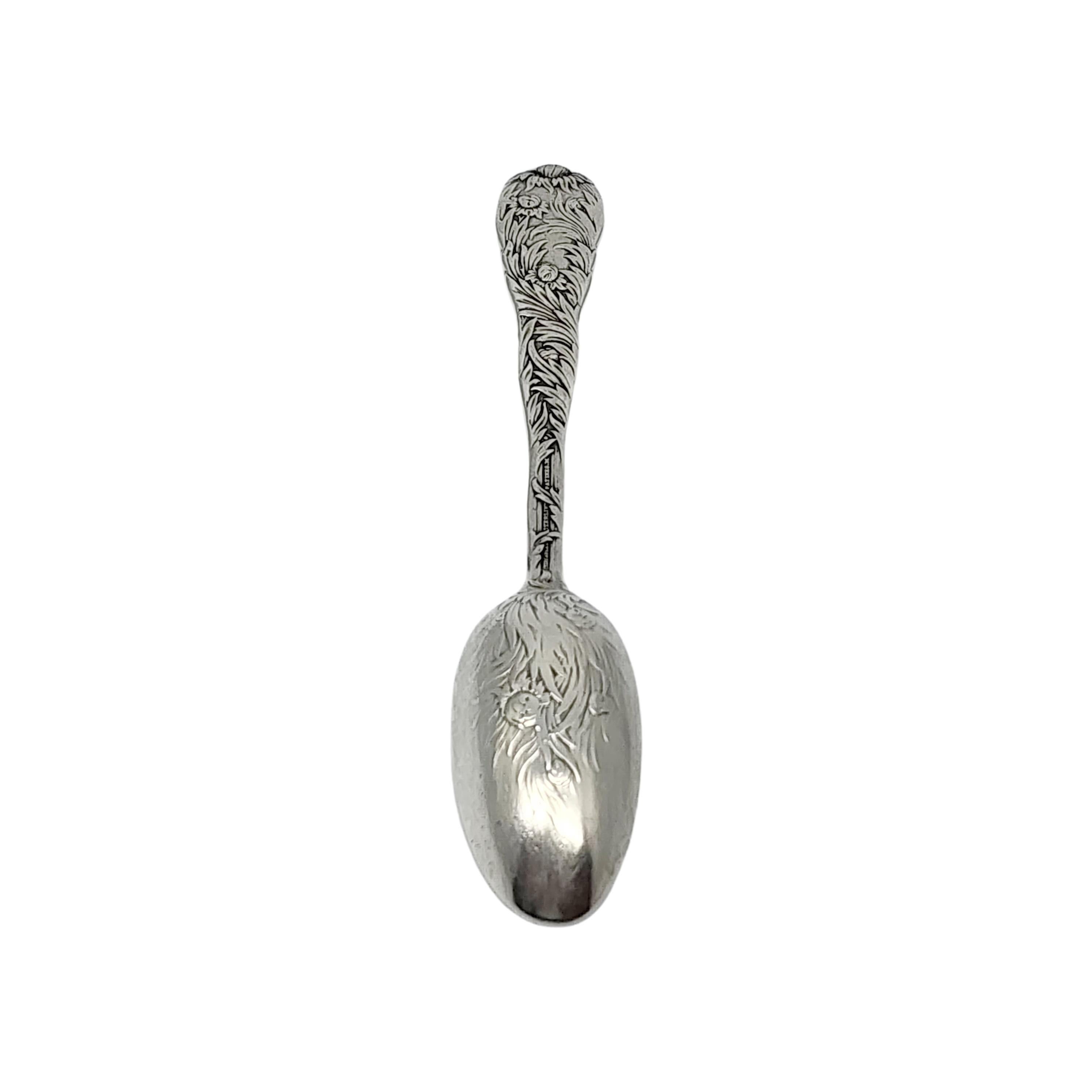 Sterling silver teaspoon by Tiffany & Co in the Chrysanthemum pattern with monogram.

Monogram appears to be EJC

The Chrysanthemum pattern, designed by Charles T. Grosjean in 1880, is an extravagant and intricate design featuring chrysanthemum buds