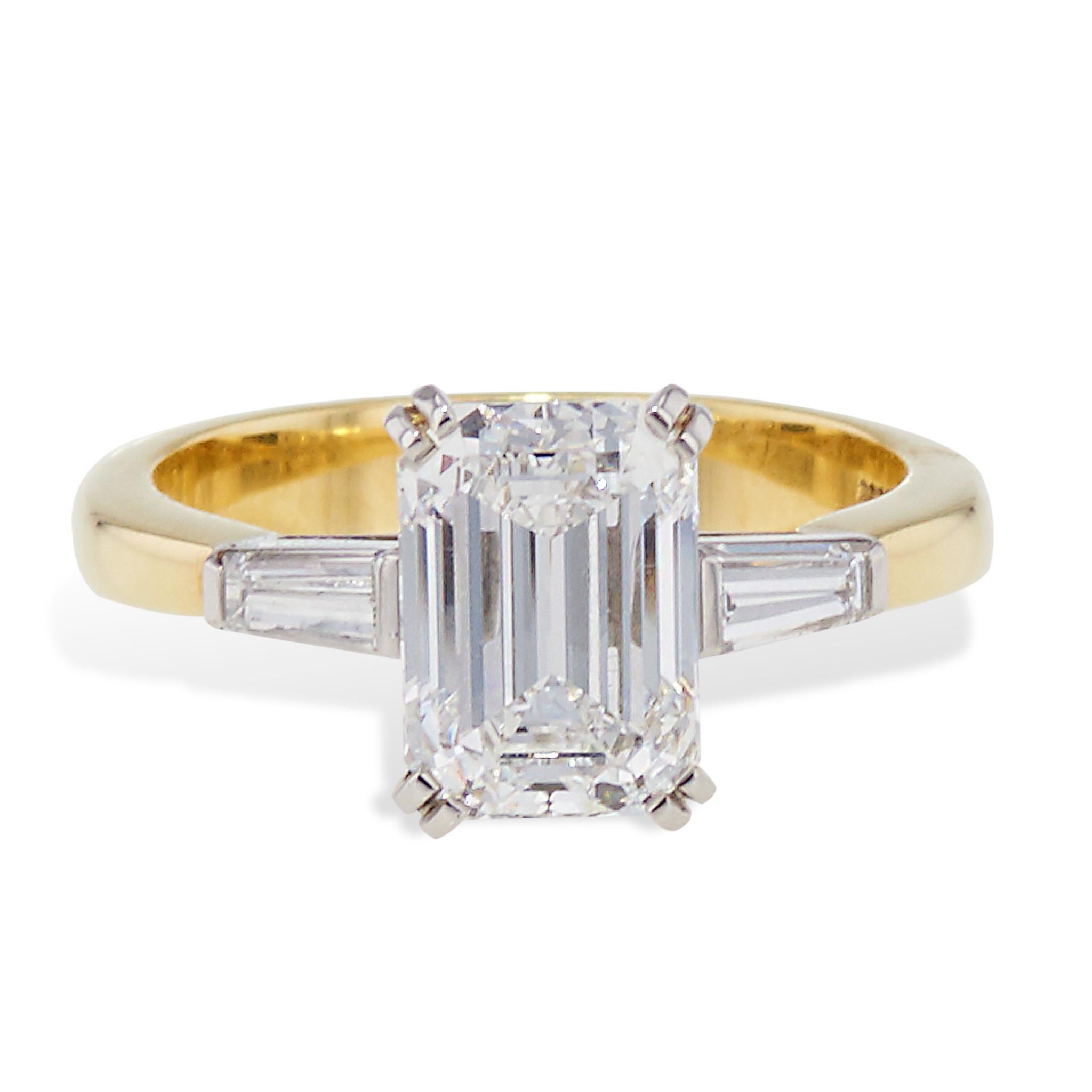 A timeless classic with an exquisite design, this Tiffany & Co. Circa 1990 Yellow Gold and Platinum Emerald Cut Diamond Ring is truly a sight to behold. 

Crafted in 18 karat yellow gold and platinum, the centerpiece is a stunning 2.52ct F-VVS2