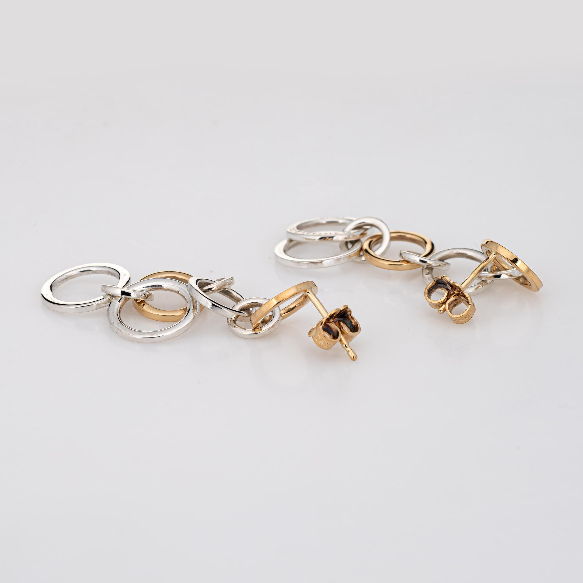 Stylish and finely detailed vintage Tiffany & Co circle link earrings, crafted in sterling silver & 18 karat yellow gold.  

The earrings feature alternating links of sterling silver & 18k gold in various sizes (6.5mm to 11mm). Measuring 1 1/2