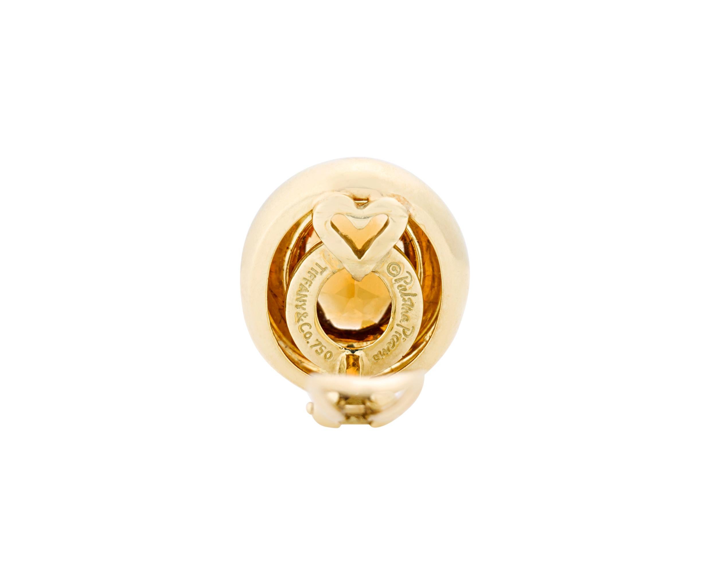 This stylish pair of citrine and 18K yellow gold stud earrings by Tiffany & Co. designer Paloma Picasso exhibits the firm's timeless artistry. The citrines, totaling approximately 6.50 carats, exhibit a vibrant shade of orange, lending these