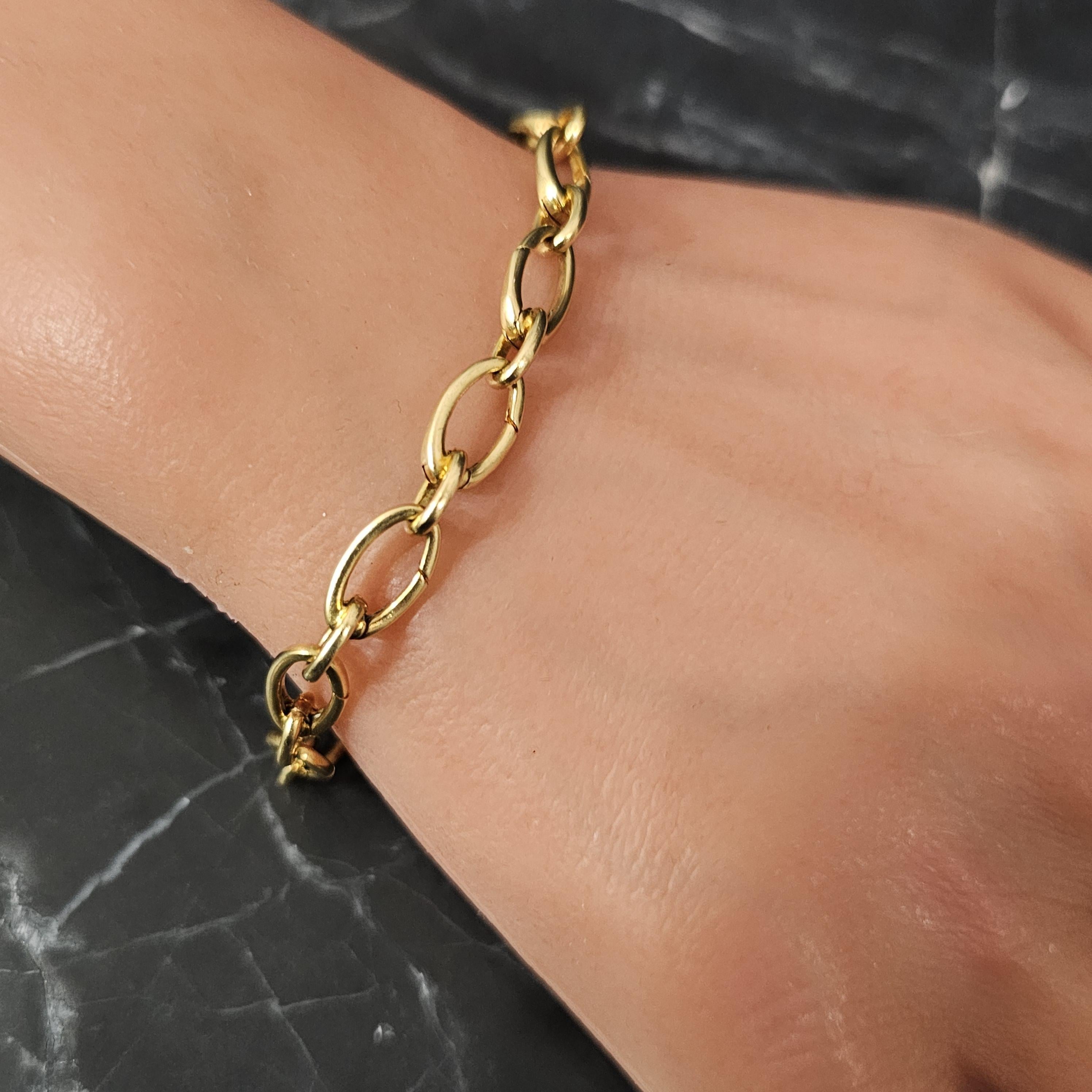 Tiffany & Co. Clasping Charm Bracelet Each Oval link Opens 18k Yellow gold 7.5