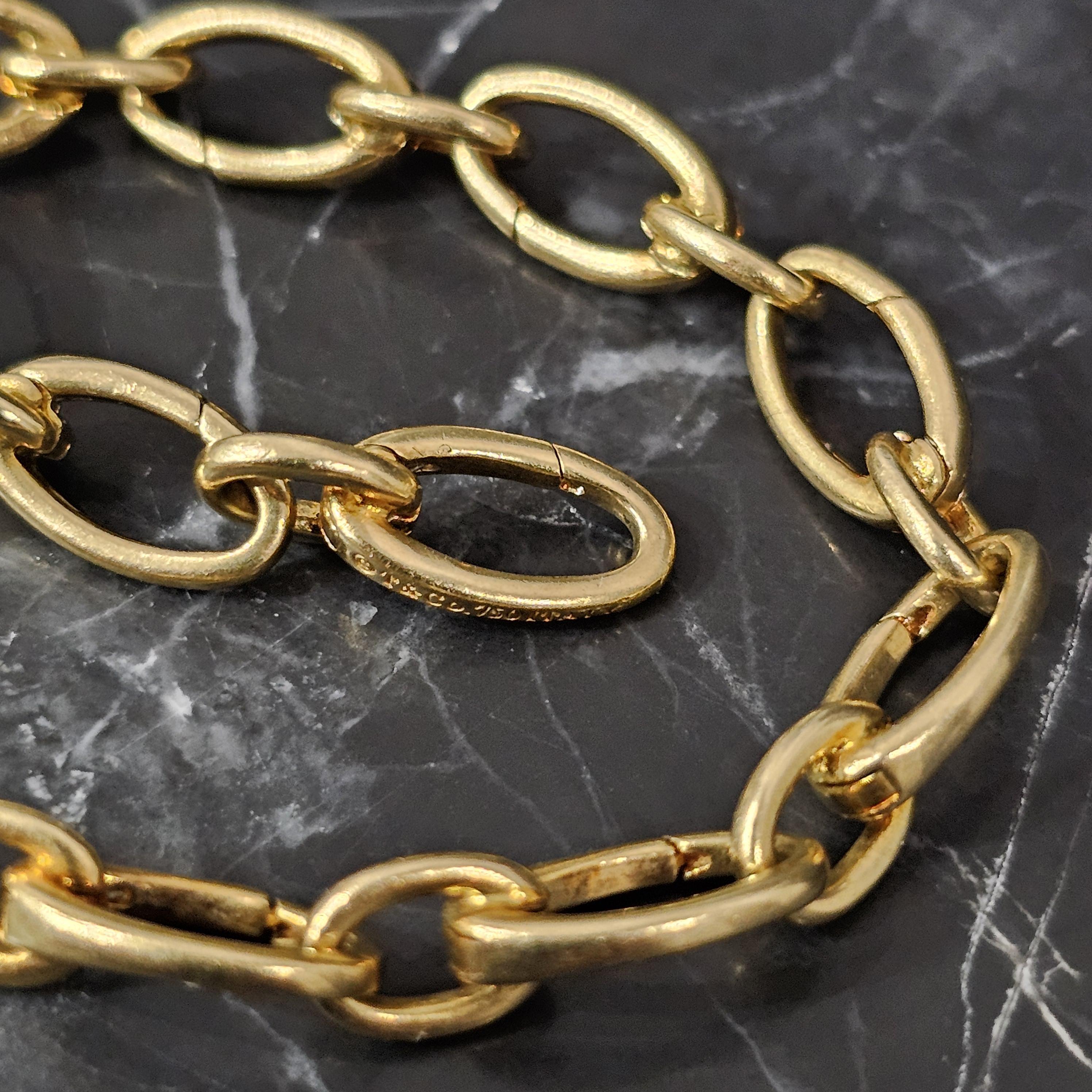 Tiffany & Co. Clasping Charm Bracelet Each Oval link Opens 18k Yellow gold 7.5