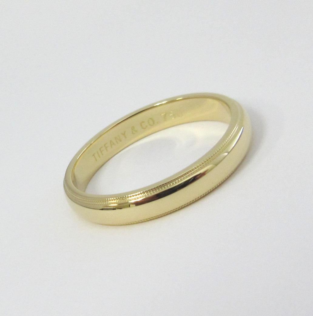 TIFFANY & Co. Classic 18K Gold 4mm Milgrain Wedding Band Ring 11

Metal: 18K Gold
Size: 11 
Band Width: 4mm
Weight: 6.40 grams
Hallmark: TIFFANY&CO. 750
Condition: Excellent condition, like new

Authenticity Guaranteed