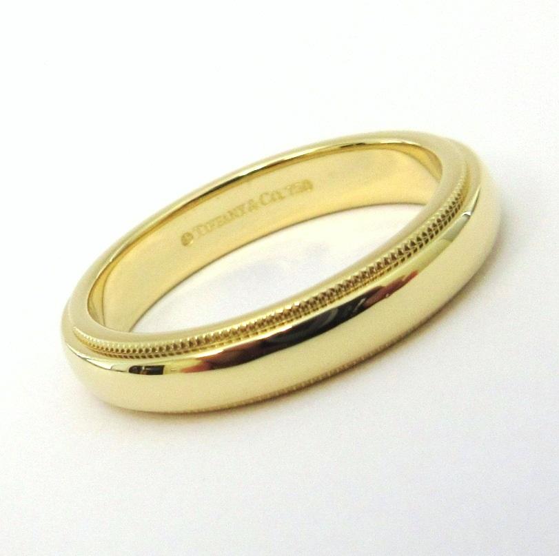 TIFFANY & Co. Classic 18K Gold 4mm Milgrain Wedding Band Ring 8

Metal: 18K Yellow Gold 
Size: 8
Band Width: 4mm
Weight: 6.60 grams 
Hallmark: ©TIFFANY&CO. 750 
Condition: Excellent condition, like new

Authenticity Guaranteed