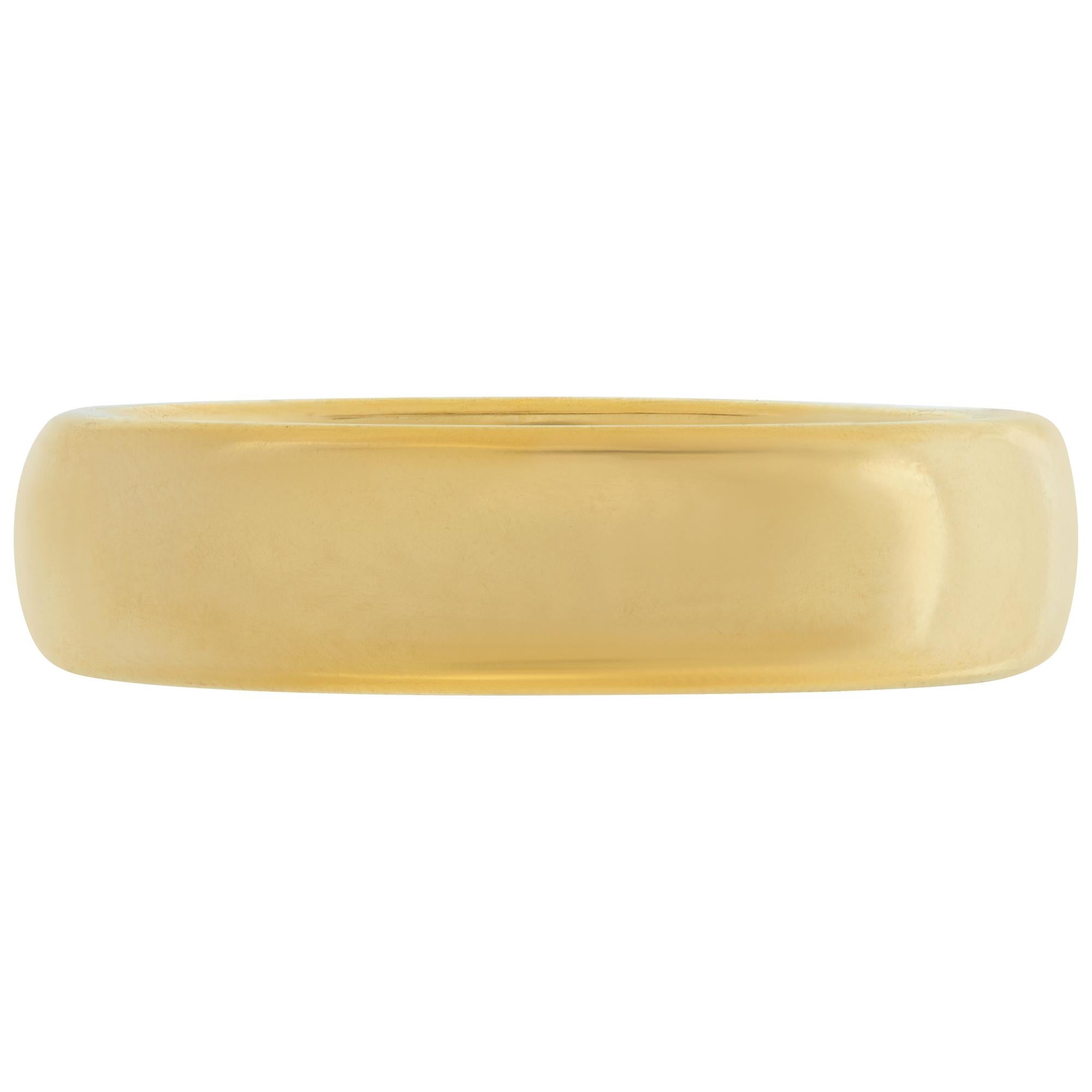 Tiffany & Co. Classic wedding band in 18k yellow gold, 4.5mm wide. Size 6.5.This Tiffany & Co. ring is currently size 4 and some items can be sized up or down, please ask! It weighs 3.5 pennyweights and is 18k.