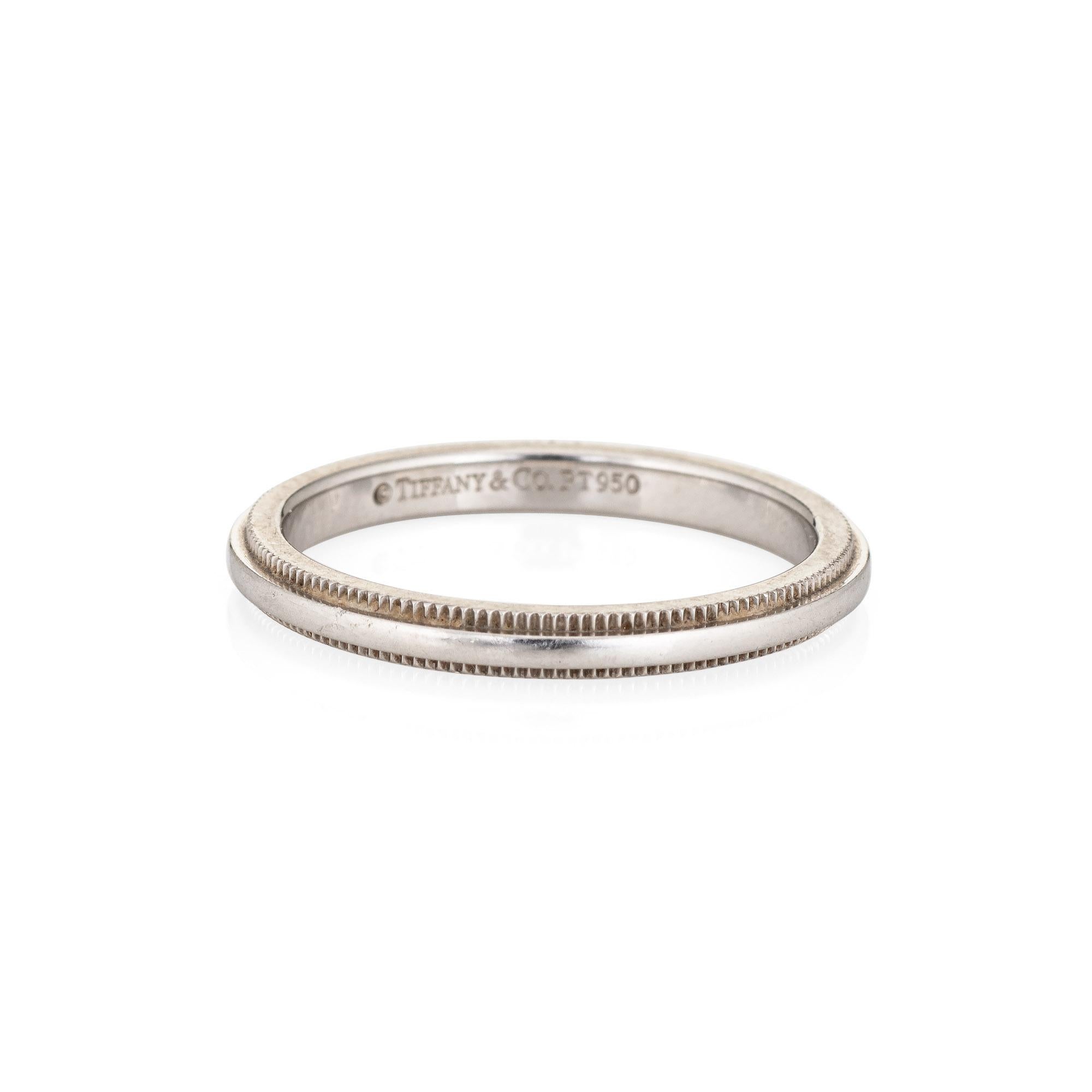 Pre-owned Tiffany & Co classic milgrain wedding band crafted in platinum (circa 2000s).  

The ring features textured milgrain edges. The 2mm band (0.07 inches) is great worn alone or stacked with your fine jewelry from any era.

The ring is in very