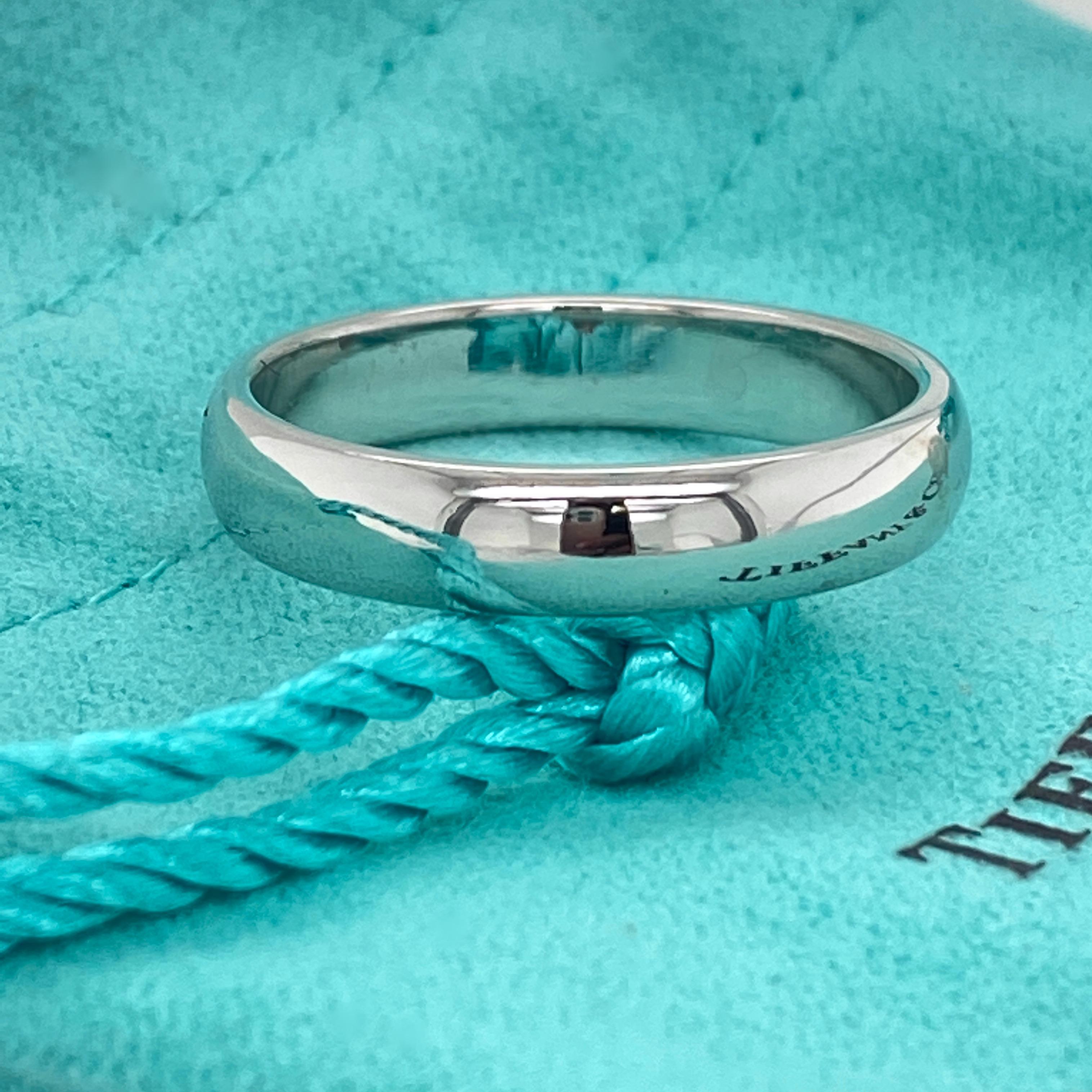 TIFFANY & CO.
Style:  Classic Wedding Band Ring
Size:  10.5 sizabe
Metal:  Platinum
Hallmark:  ©TIFFANY&CO. PT950
Includes:  T&C Pouch
Retail:  $1,950

Sku#11050TMT022920-10.5SZ