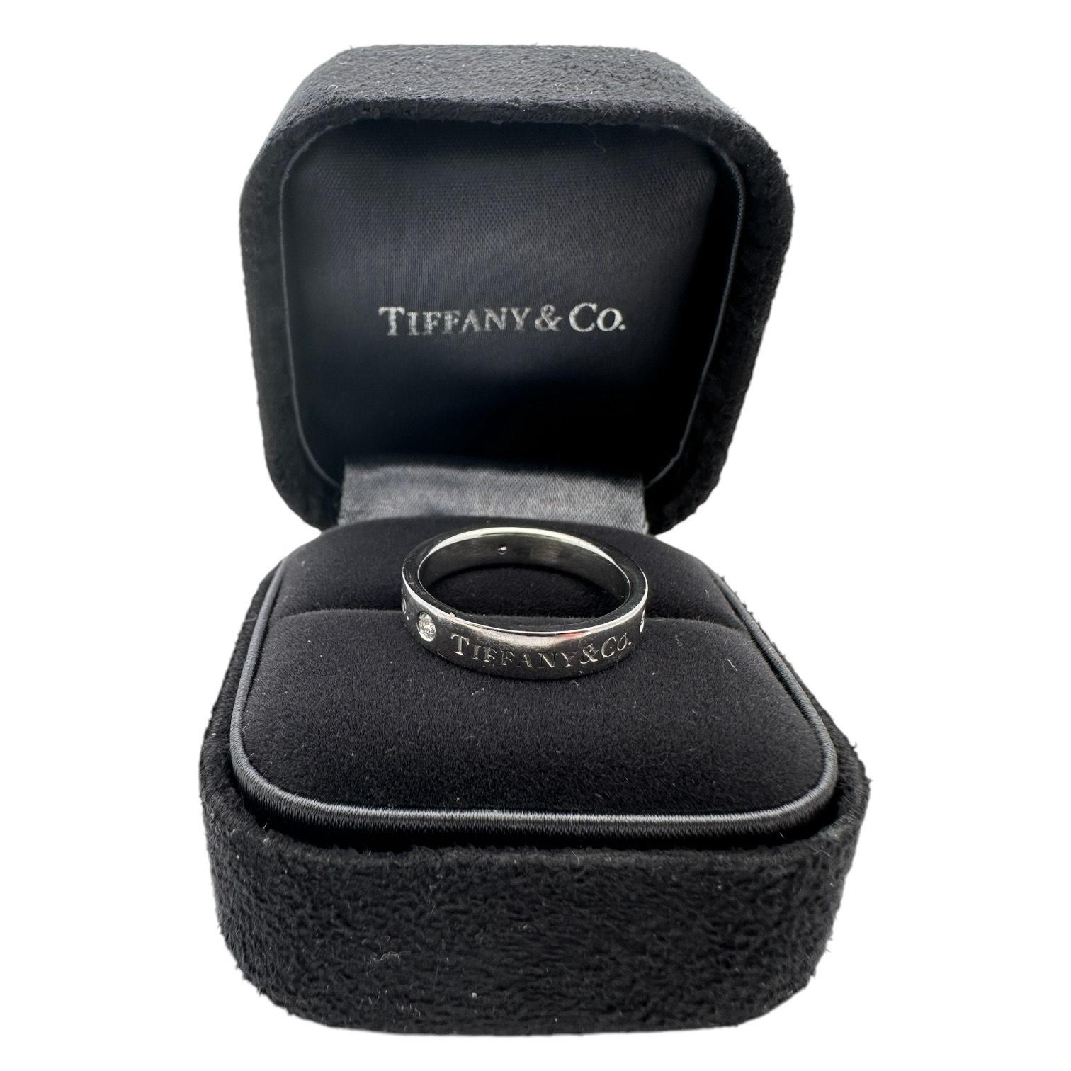 Tiffany & Co. Classic Band Ring, platinum featuring 3 round brilliant diamonds. The band style showcases 