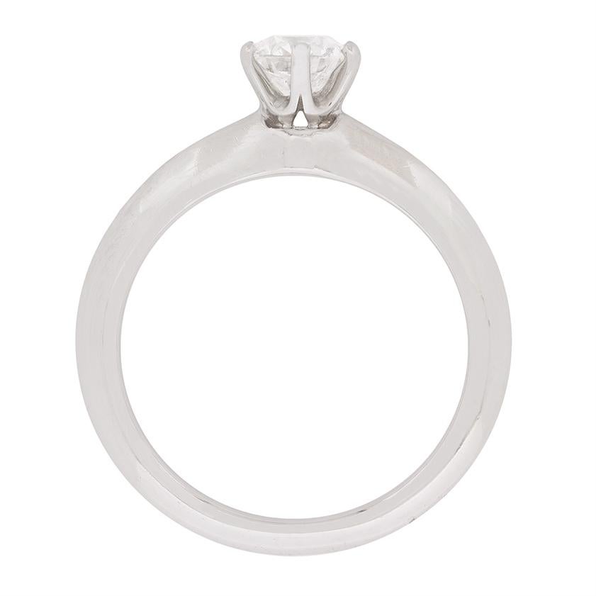 Timeless in design and classically Tiffany & Co, this diamond solitaire ring features a 0.52 carat diamond. It is F in colour and VVS2 in clarity,. The impeccable quality is typical is the world-renowned designer and the dazzling stone is set within