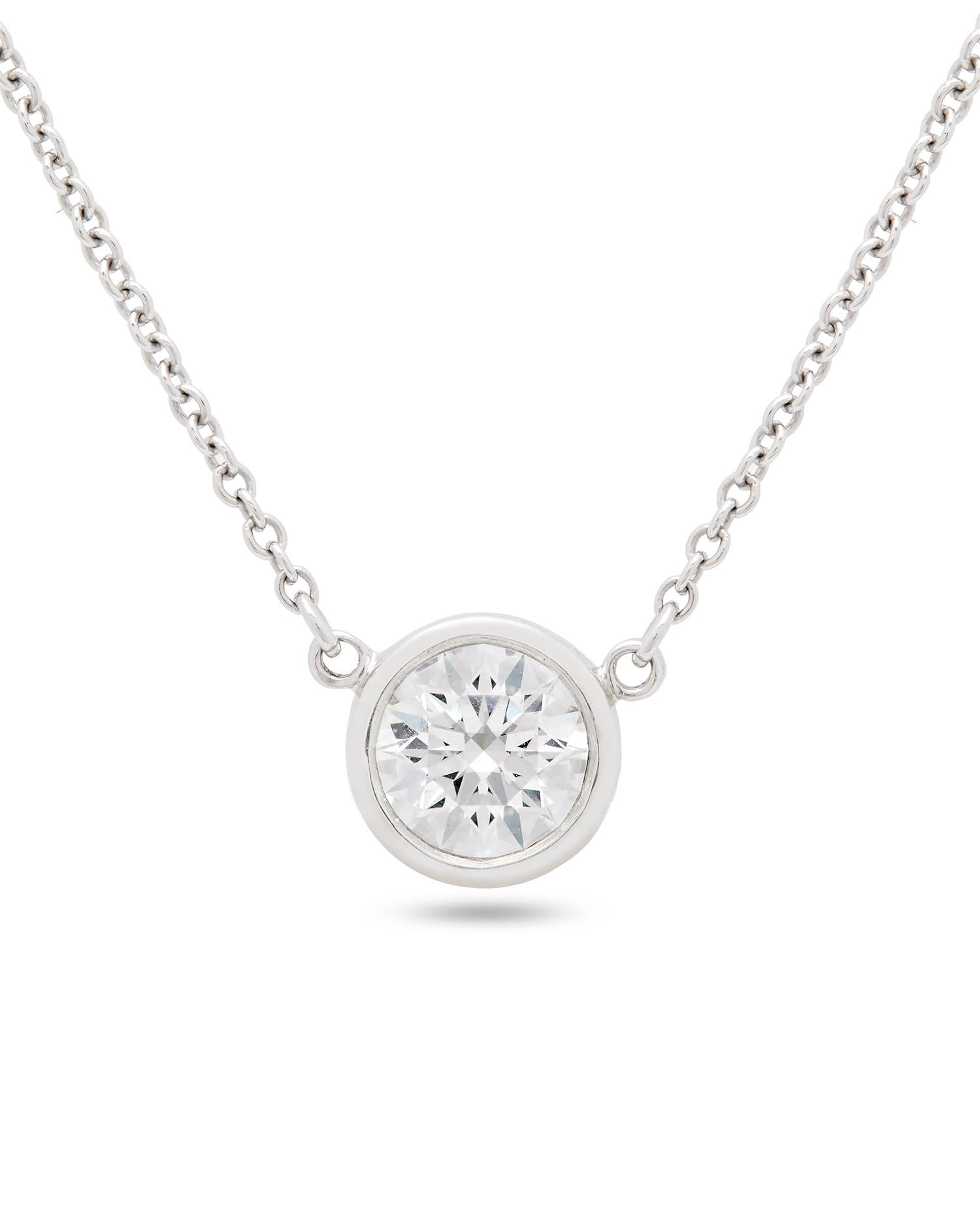 A diamond necklace from the world renowned jewellery designer, Tiffany & Co. This piece forms part of the Elsa Peretti collection and showcases a single 0.60ct round brilliant cut diamond in a Rub-over setting upon a plain platinum belcher