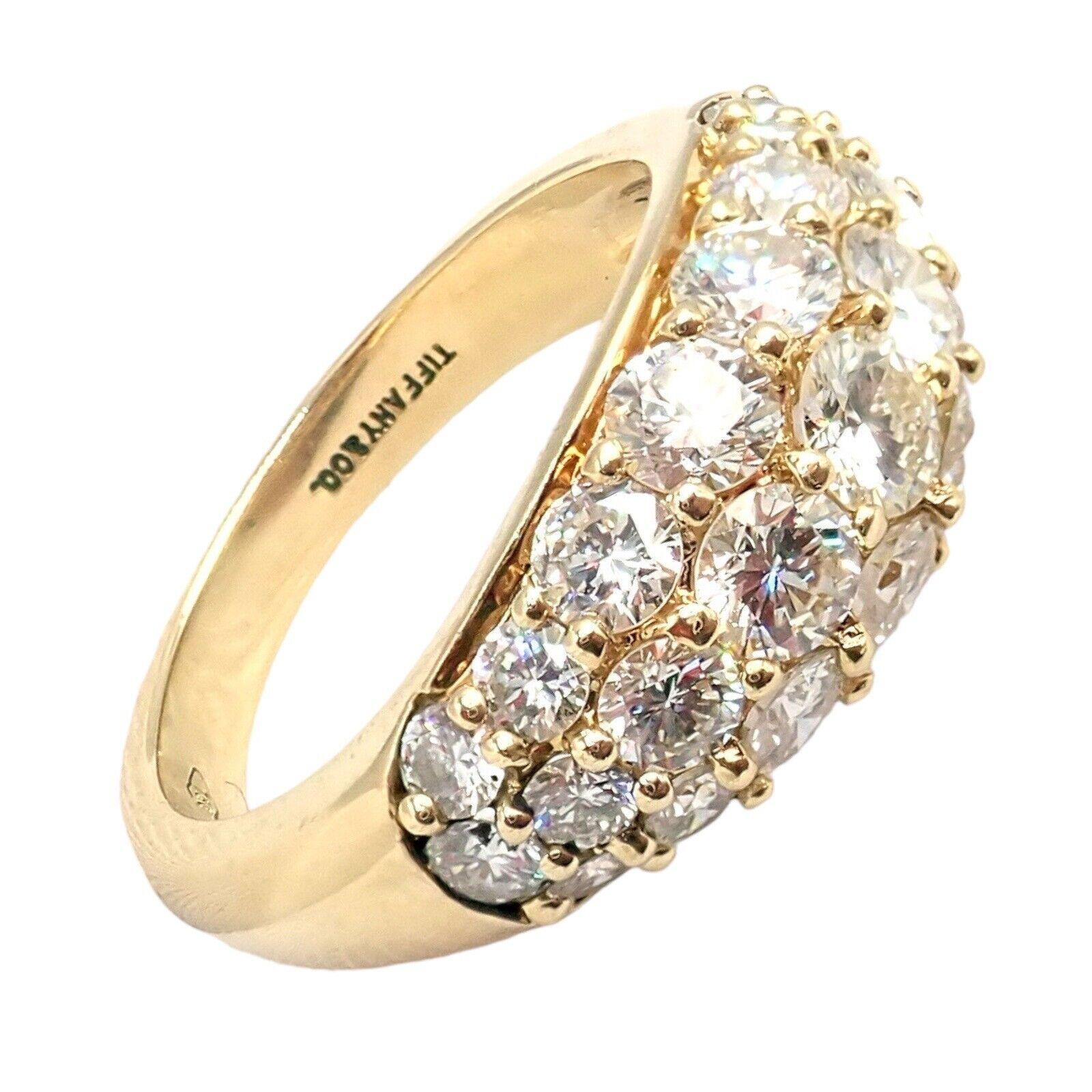18k Yellow Gold Diamond Band Ring by Tiffany & Co.
With 25 Round Brilliant Cut Diamonds VS1 clarity, G color, Total weight Approximately 2.40ctw
Details:
Ring Size: 6.5
Weight: 6.7 grams
Stamped Hallmarks: Tiffany & Co 750
*Free Shipping within the