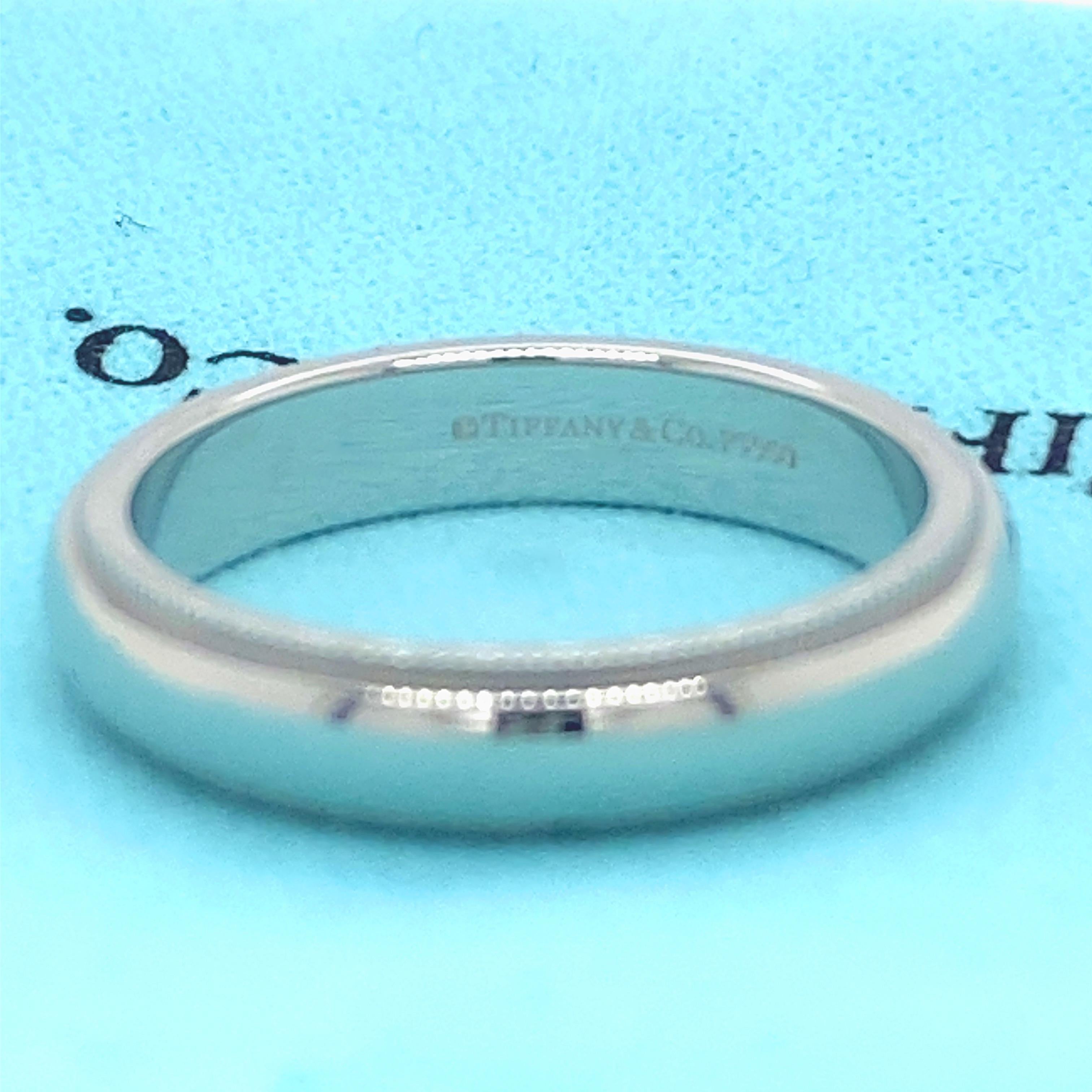 Tiffany & Co. Wedding Band Ring
Style:  Milgrain Trim 
Metal:  Platinum PT950
Size:  7
Width:  4 MM
Hallmark:  ©TIFFANY&CO. PT950
Includes:  T&C Jewelry Pouch
Retail:  $1,750

Sku#11401TSD011121-7