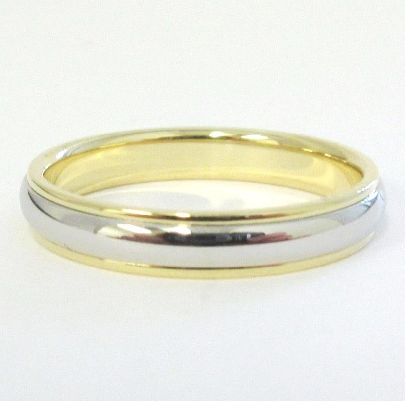 TIFFANY & Co. Classic Platinum 18K Yellow Gold 4mm Lucida Wedding Band Ring 10.5 

Métal : Platine et or jaune 18 carats
Taille : 10.5 
Largeur de la bande : 4mm
Poids : 6.30 grammes
Poinçon : ©TIFFANY&CO. 750 PT950
Condit : Excellent état, comme