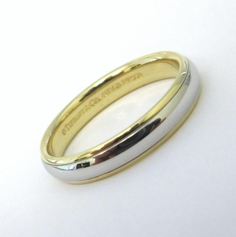 TIFFANY & Co. Classic Platinum 18K Yellow Gold 4mm Lucida Wedding Band Ring 8.5 

Metal: Platinum and 18K Yellow Gold
Size: 8.5 
Band Width: 4mm
Weight: 6.20 grams
Hallmark: 