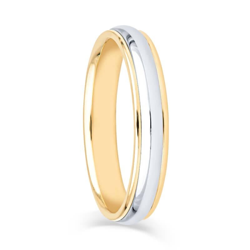 A sophisticated and beautiful wedding band crafted from Platinum and 18k yellow gold. The center features a high polished platinum dome complemented by the 18k yellow gold double edge and a smooth polished finish. The hallmark states Tiffany & Co.