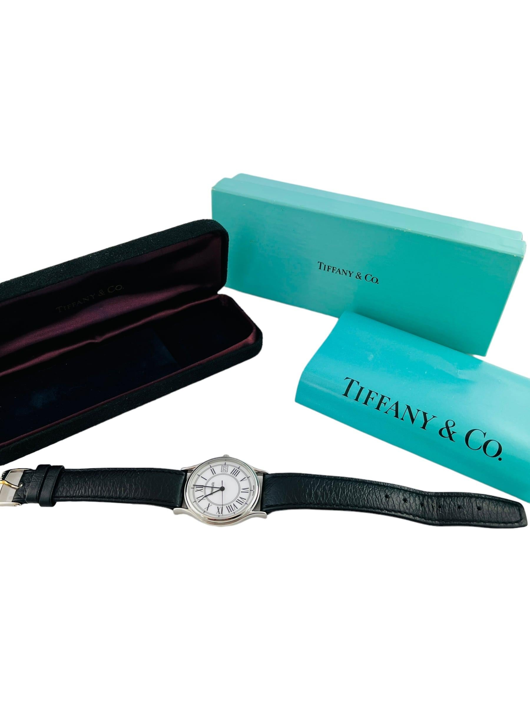 Tiffany & Co. Classic Watch 

This classic Tiffany & Co. watch is set in stainless steel with a leather band

Stainless steel case is 33mm in diameter

Quartz movement

Tiffany & Co. Leather band with Tiffany stainless buckle

Watch is 9