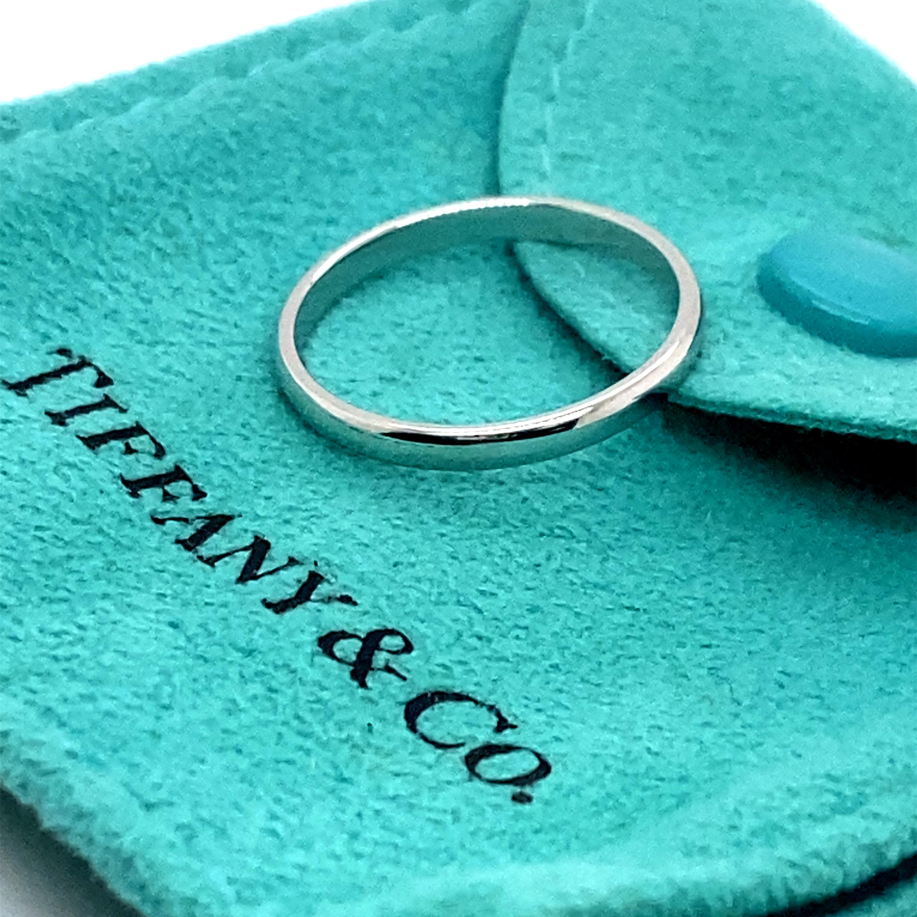 Tiffany & Co Classic Band Ring
Style:  Classic
Ref. number:  Sku# 60001623
Metal:  Platinum
Size:  6.75
Measurements:  2 MM 
Hallmark:  ©TIFFANY&CO PT950
Includes:  T&C Ring Pouch
Retail:  $900
Sku##11068BJ051222-6.75