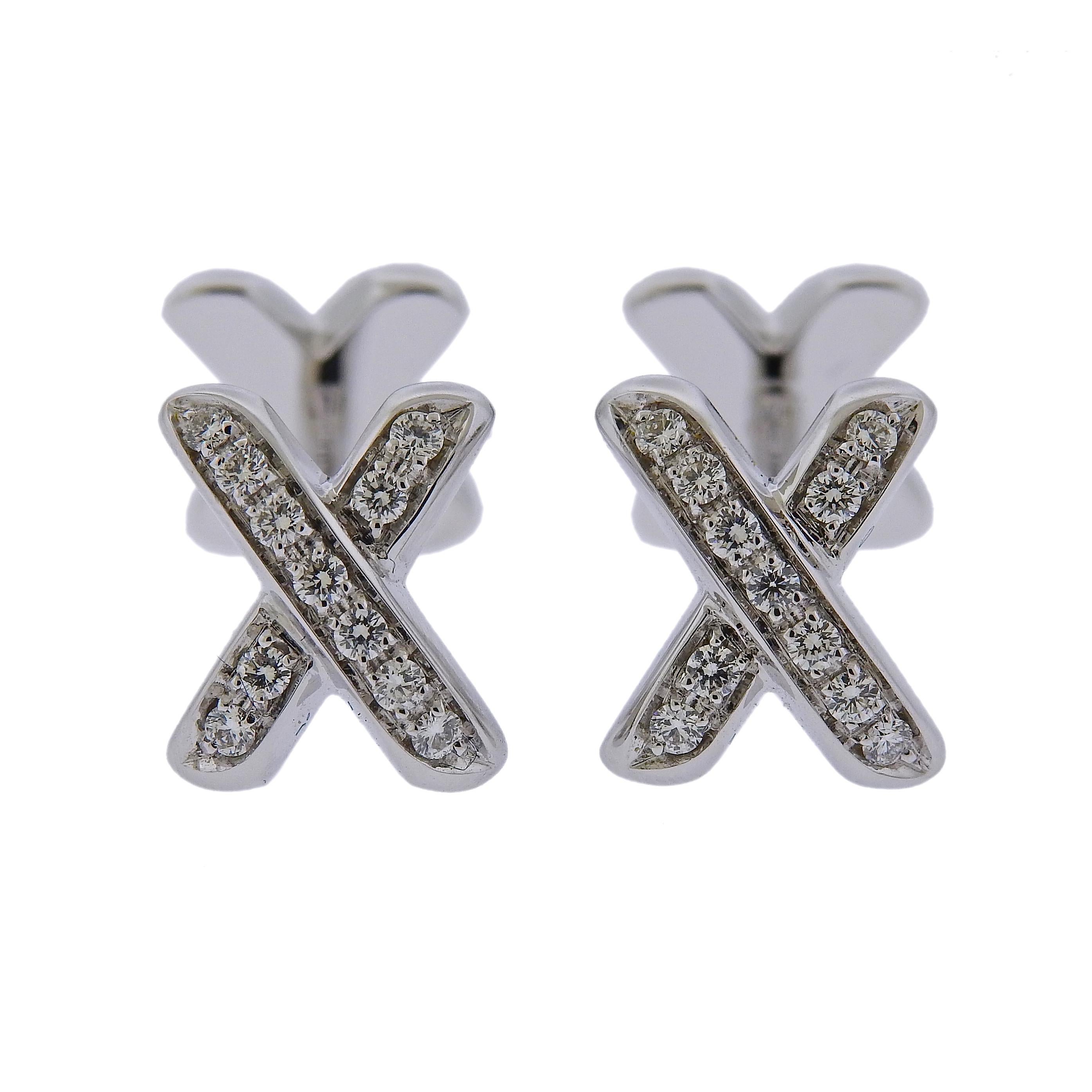 Pair of classic X cufflinks, crafted by Tiffany & Co in 18k white gold, adorned with approx. 0.36ctw in G/VS diamonds. Cufflink top - 14mm x 10mm. Weight: 14.1 grams. Marked: T & Co, 750, Italy. 