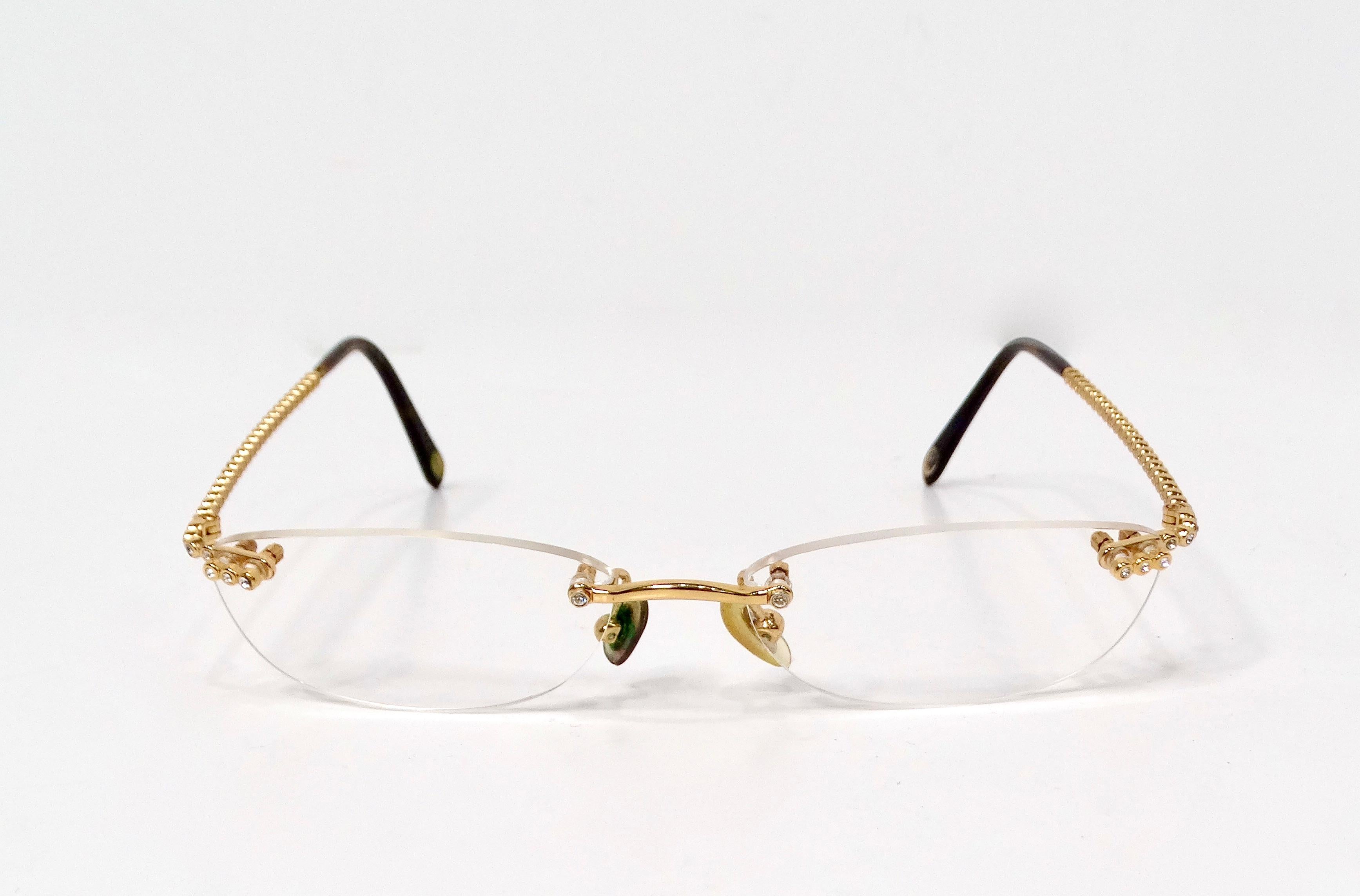 The Tiffany & Co. Clear Gold Plated Rimless Prescription Eyeglasses with Crystal Details embody understated elegance and sophisticated craftsmanship. These rimless, skinny glasses feature a minimalist design that enhances your natural features while