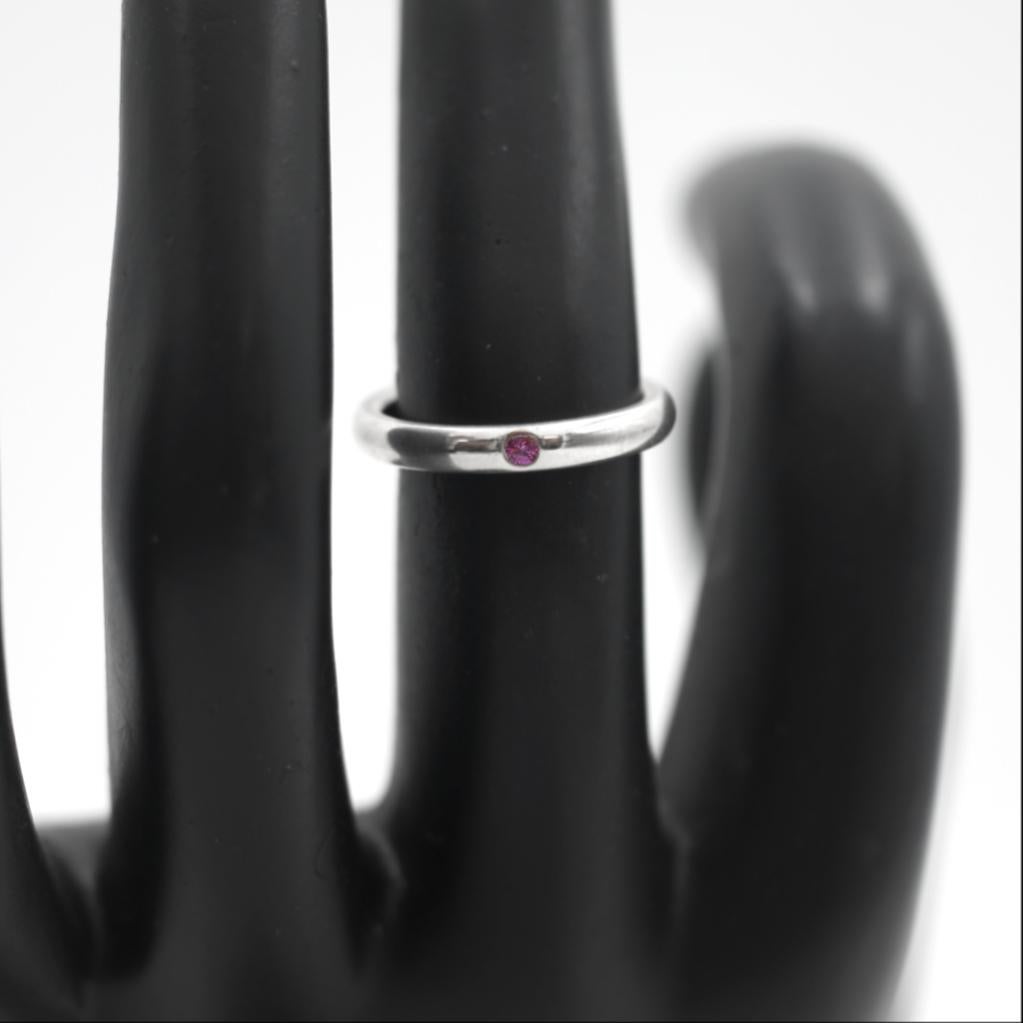 Tiffany & Co. 
Elsa Peretti 
925 Sterling Silver
Pink Sapphire
Stacking Ring
Hard to find
size 5
The ring is Hallmarked Tiffany & Co 925
This beautiful pre-loved ring is in great looking condition. This ring has some wear which is consistent with