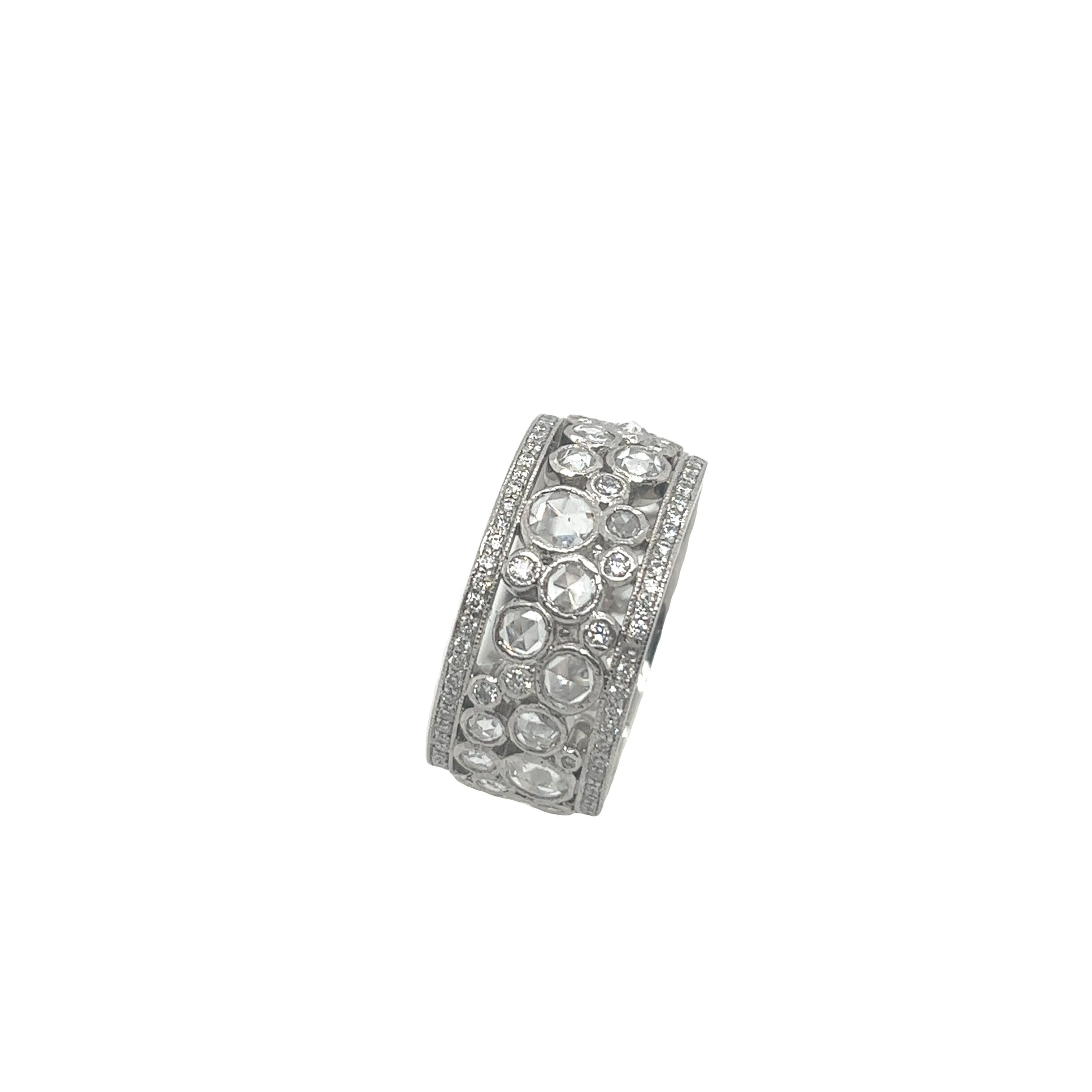 Presenting the stunning pre-loved Tiffany & Co Cobblestone ring, 
in platinum and adorned with a remarkable collection of diamonds. 
This exquisite ring, with a width of 10mm, offers a bold and fashionable statement.
Featuring approximately 2.10