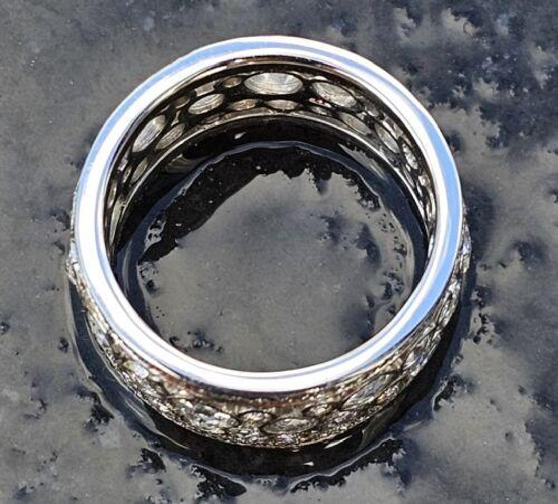 This exquisite ring by Tiffany & Co. features a beautiful cobblestone design in platinum, with a stunning rose cut and round brilliant diamonds all the way around.

The ring is a size 5.5 and comes with a Tiffany black box as shown. Ring was just