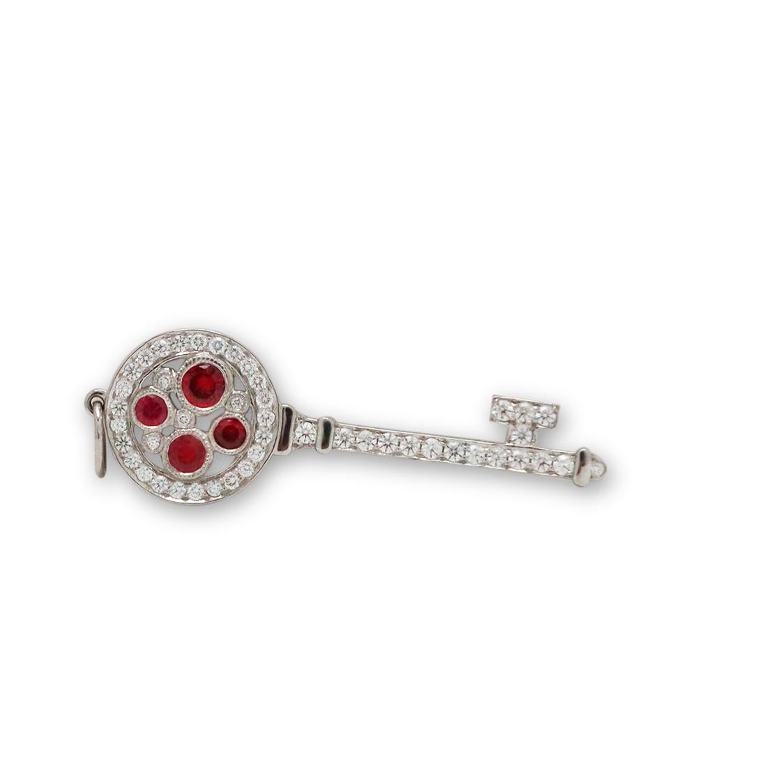 Authentic Tiffany & Co. 'Cobblestone' charm from the Tiffany Keys collection crafted in platinum. The charm is set with approximately 0.34 carats of round brilliant cut diamonds and approximately 0.19 carats of round brilliant cut rubies. The charm